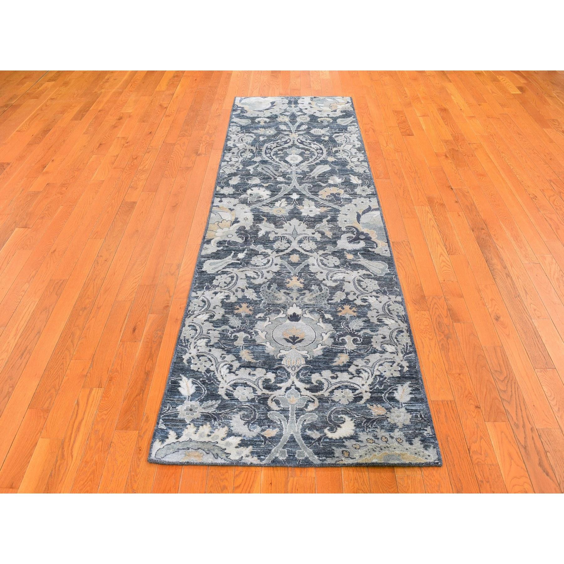 This is a truly genuine one-of-a-kind Gray Silk with Textured Wool Palmette Motif Hand Knotted Wide Runner Oriental Rug. It has been woven for months and months in the centuries-old Persian weaving craftsmanship techniques by expert