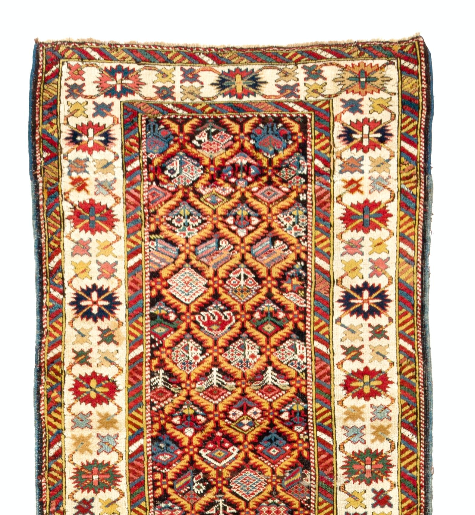 A fine North East Caucasian runner with an intricate design and refined natural dyes. Excellent condition. Sturdy and as clean as a brand new rug (deep washed professionally). Measures: 3 x 11 ft.