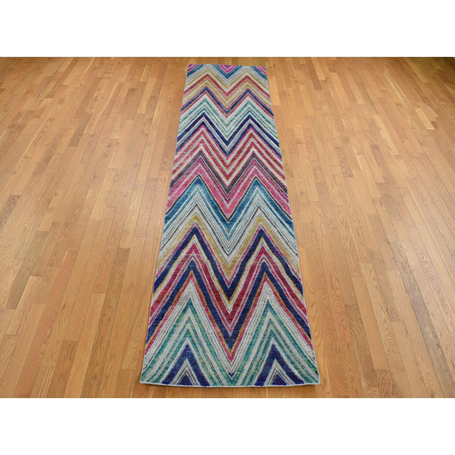 Colorful, Chevron Design, Sari Silk and Textured Wool, Hand Knotted, Runner, Oriental Rug
Primary materials: Wool & Silk
Latex: No Pile 
height: 0.25 Inches
Style: Transitional
Primary color: Red
Secondary colors: Royal Blue, Yellow, Spring Green,