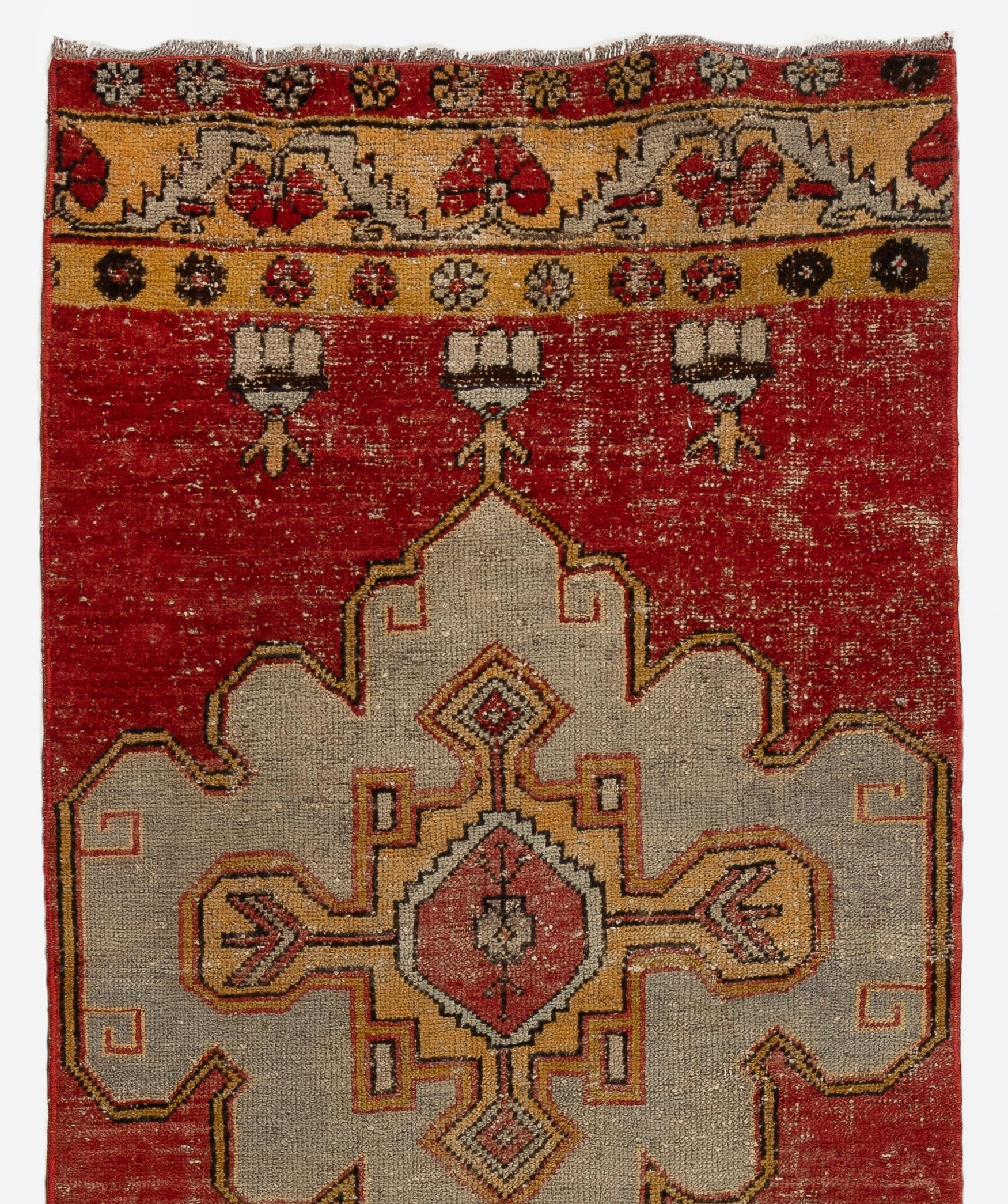 Vintage Turkish runner rug that features a lovely design of floral shaped multiple medallions in light blue and gold against a beautiful plain background in striated red as well as intricate top and bottom borders in goldenrod yellow decorated with
