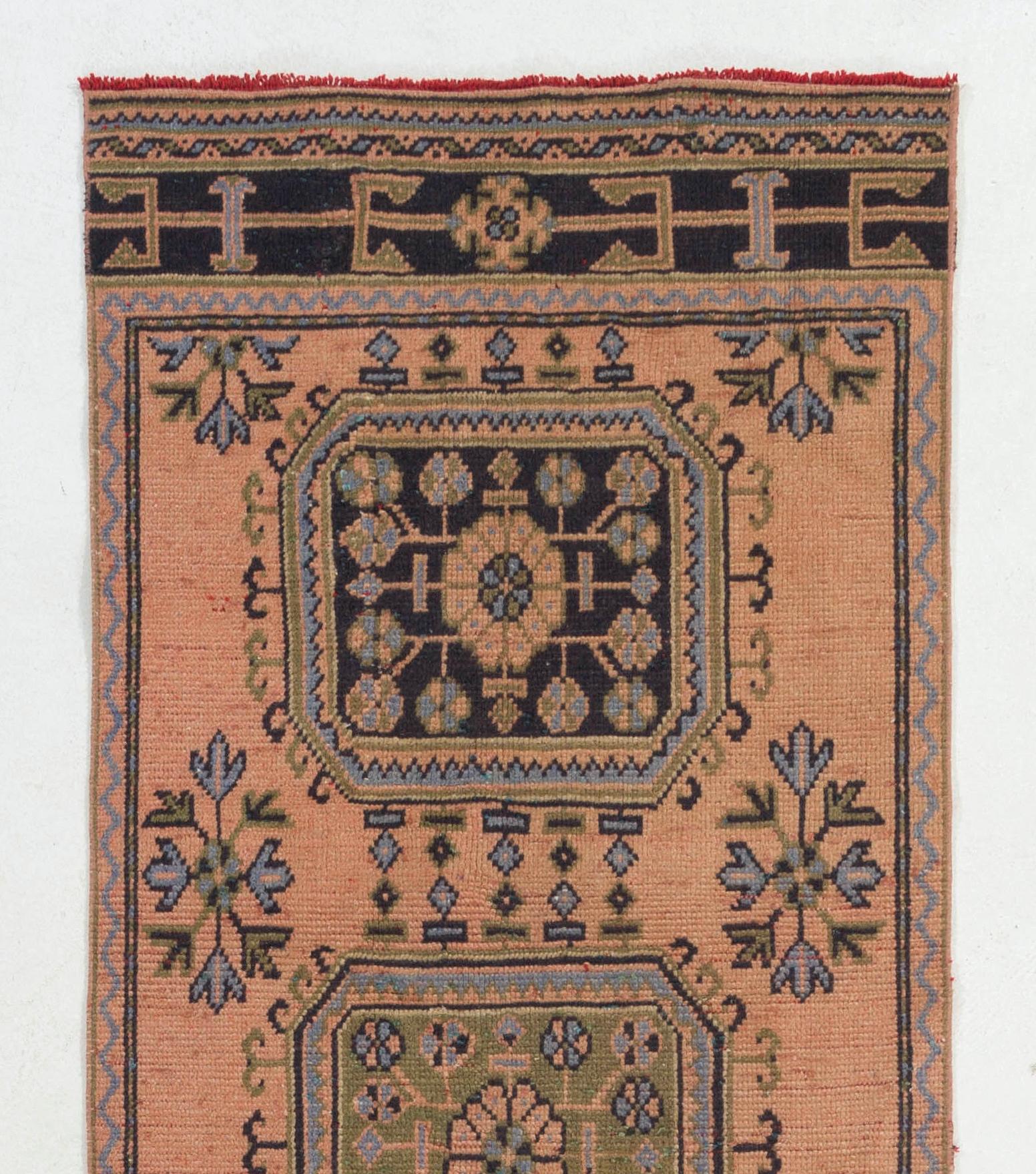 A vintage Turkish runner rug. Finely hand-knotted with even medium wool pile on wool foundation. Very good condition. Sturdy and as clean as a brand new rug (deep washed professionally). 
Size: 3 x 11.7 ft.