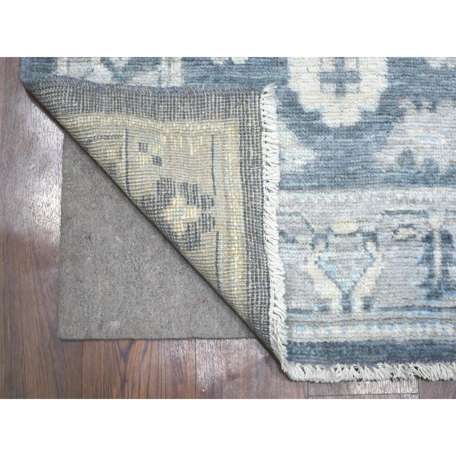 This is a truly genuine one-of-a-kind Charcoal Gray Angora Oushak With Colorful Leaf Design Natural Dyes, Afghan Wool Hand Knotted Runner Oriental Rug. It has been Knotted for months and months in the centuries-old weaving craftsmanship techniques