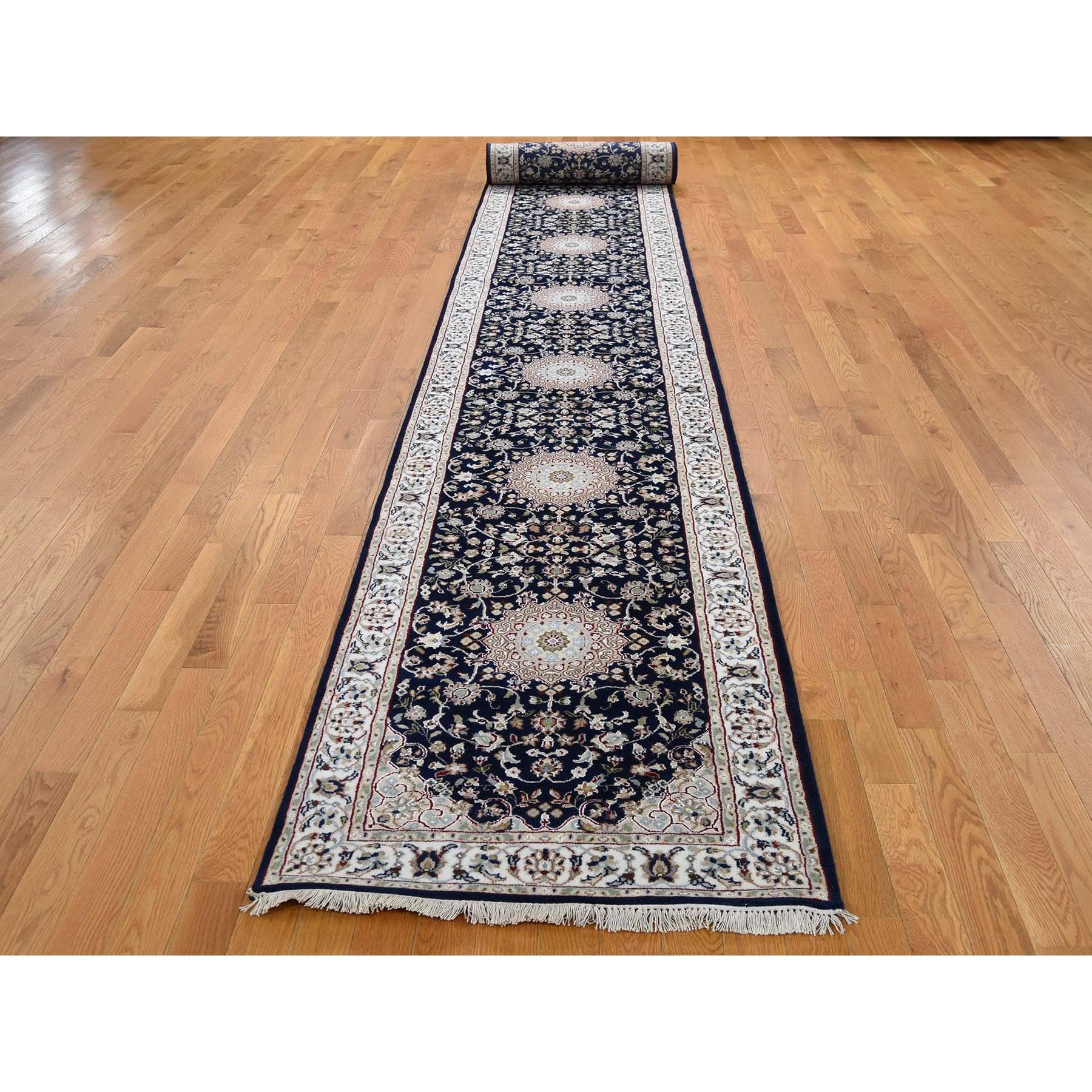 This is a truly genuine one-of-a-kind Navy Blue Wool 250 KPSI Nain XL Runner Hand Knotted Oriental Rug. It has been woven for months and months in the centuries-old Persian weaving craftsmanship techniques by expert artisans.
Primary materials: