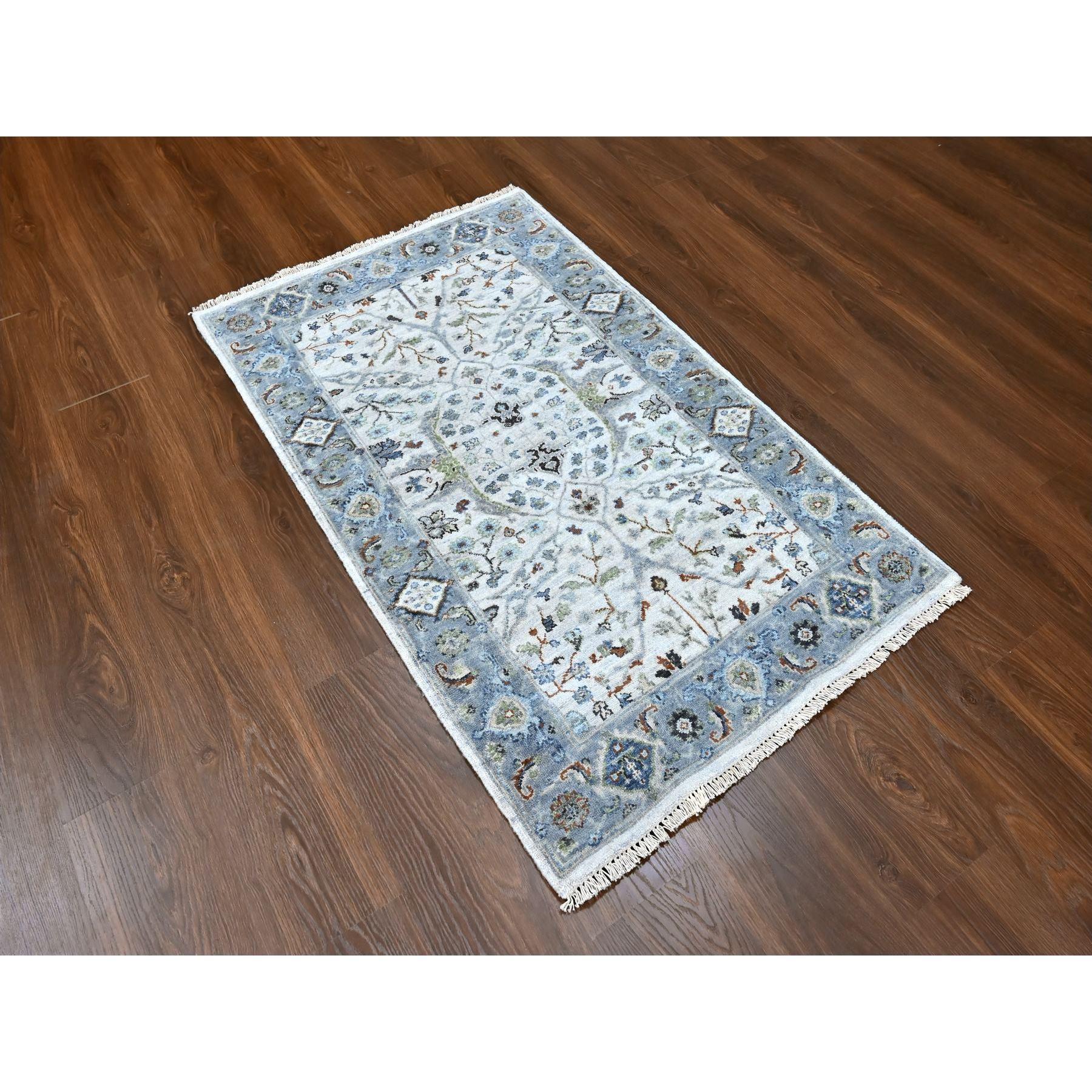 Chiffon White, Hand Knotted, Oushak with Floral Motifs, Densely Woven, Pure Wool, Oriental Rug
Primary materials: Wool
Latex: No Pile 
height: 0.25 Inches
Style: Transitional
Primary color: Ivory
Secondary colors: Green, Black, Brown, Light Blue,