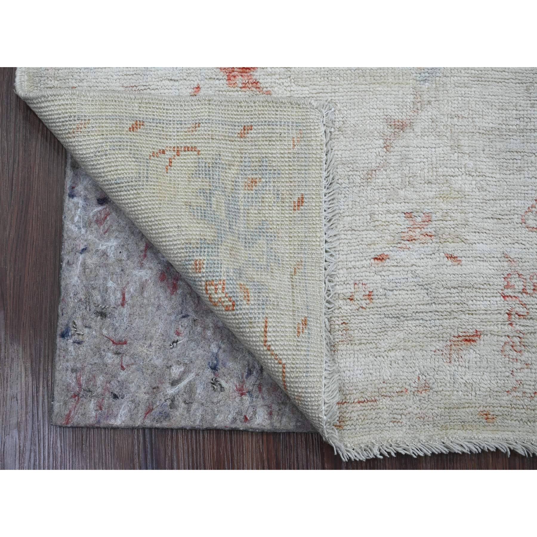 Bone White with Touches of Red, Leaf Design, Afghan Angora Oushak, Hand Knotted, Veggie Dyes, 100% Wool, Oriental Rug
Primary materials: Wool
Latex: No Pile 
height: 0.25 Inches
Style: Transitional
Primary color: Ivory
Secondary colors: Red, Blue,