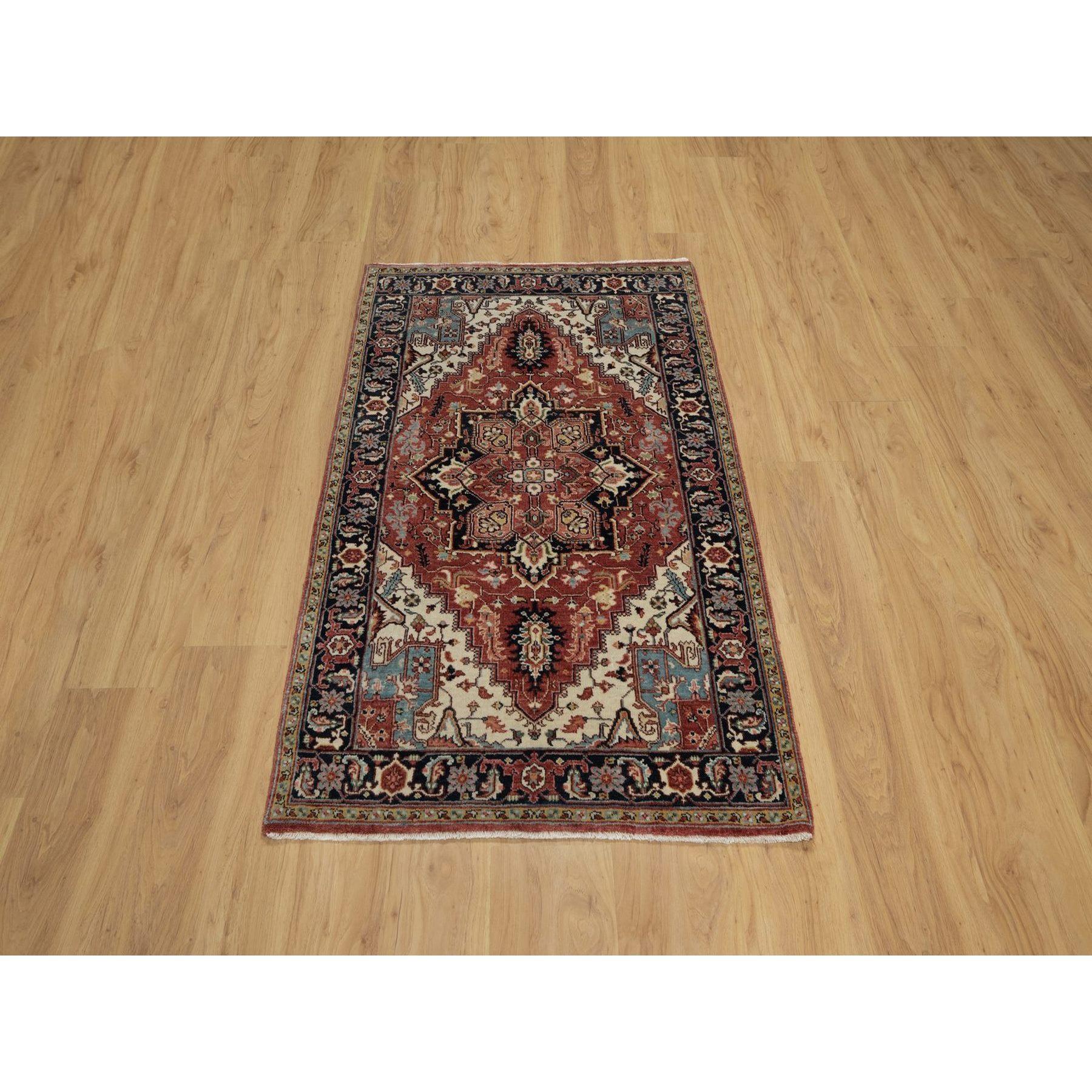 Brick Red, Antiqued Fine Heriz Re-Creation with Geometric Medallion Design, Hand Knotted, Hand Spun New Zealand Wool, Soft and Plush, Oriental Rug
Primary materials: Wool
Latex: No Pile 
height: 0.25 Inches
Style: Traditional
Primary color: