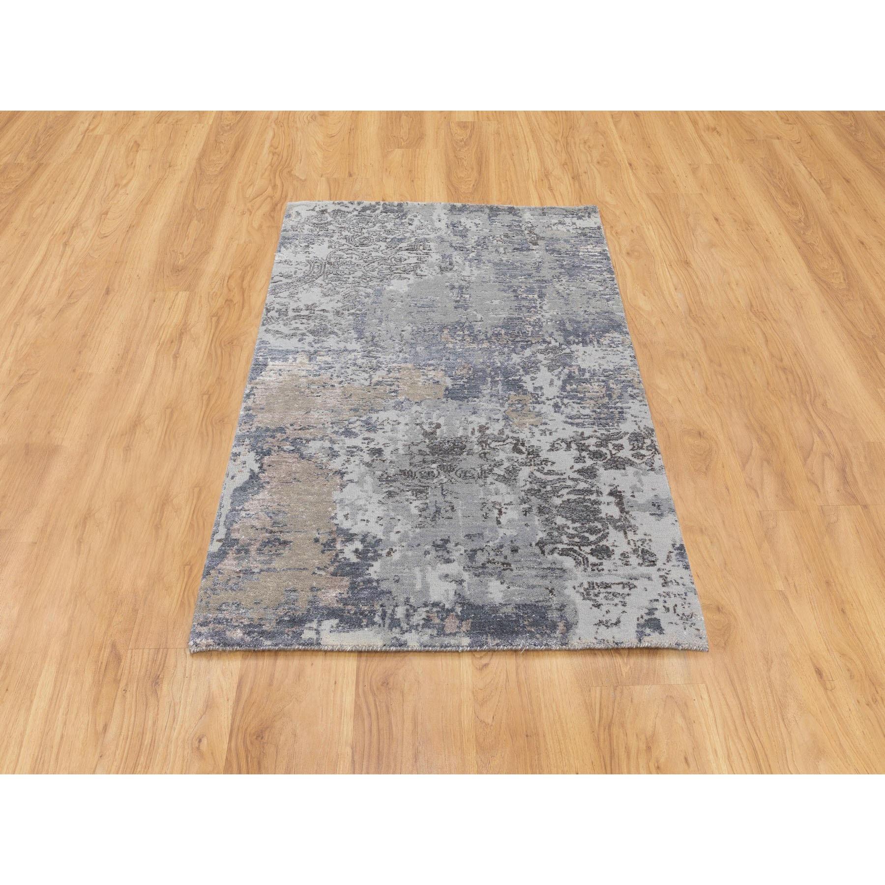 This is a truly genuine one-of-a-kind Gray Erased Design Wool & Silk Hand Knotted Oriental Rug. It has been Knotted for months and months in the centuries-old Persian weaving craftsmanship techniques by expert artisans.
Primary materials: Wool &
