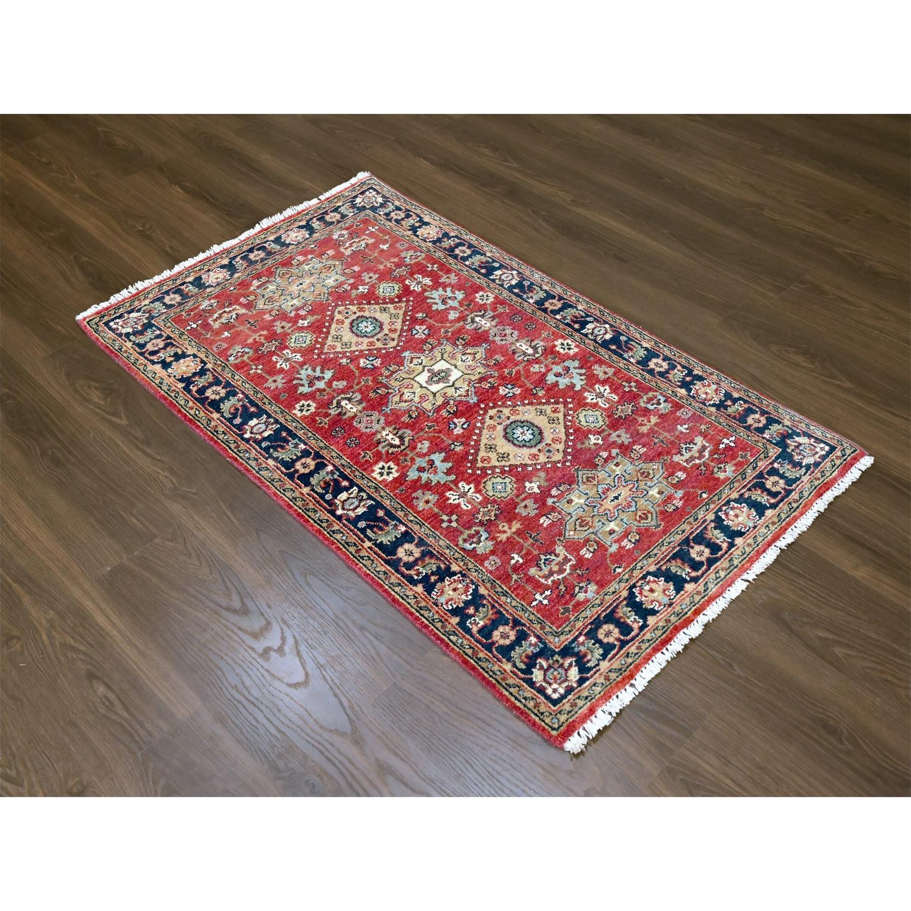 Candy Red, Karajeh Design with Geometric Medallions, Hand Knotted, Soft Wool, Oriental Rug
Primary materials: Wool
Latex: No Pile 
height: 0.25 Inches
Style: Traditional
Primary color: Red
Secondary colors: Green, Light Blue, Yellow, White,