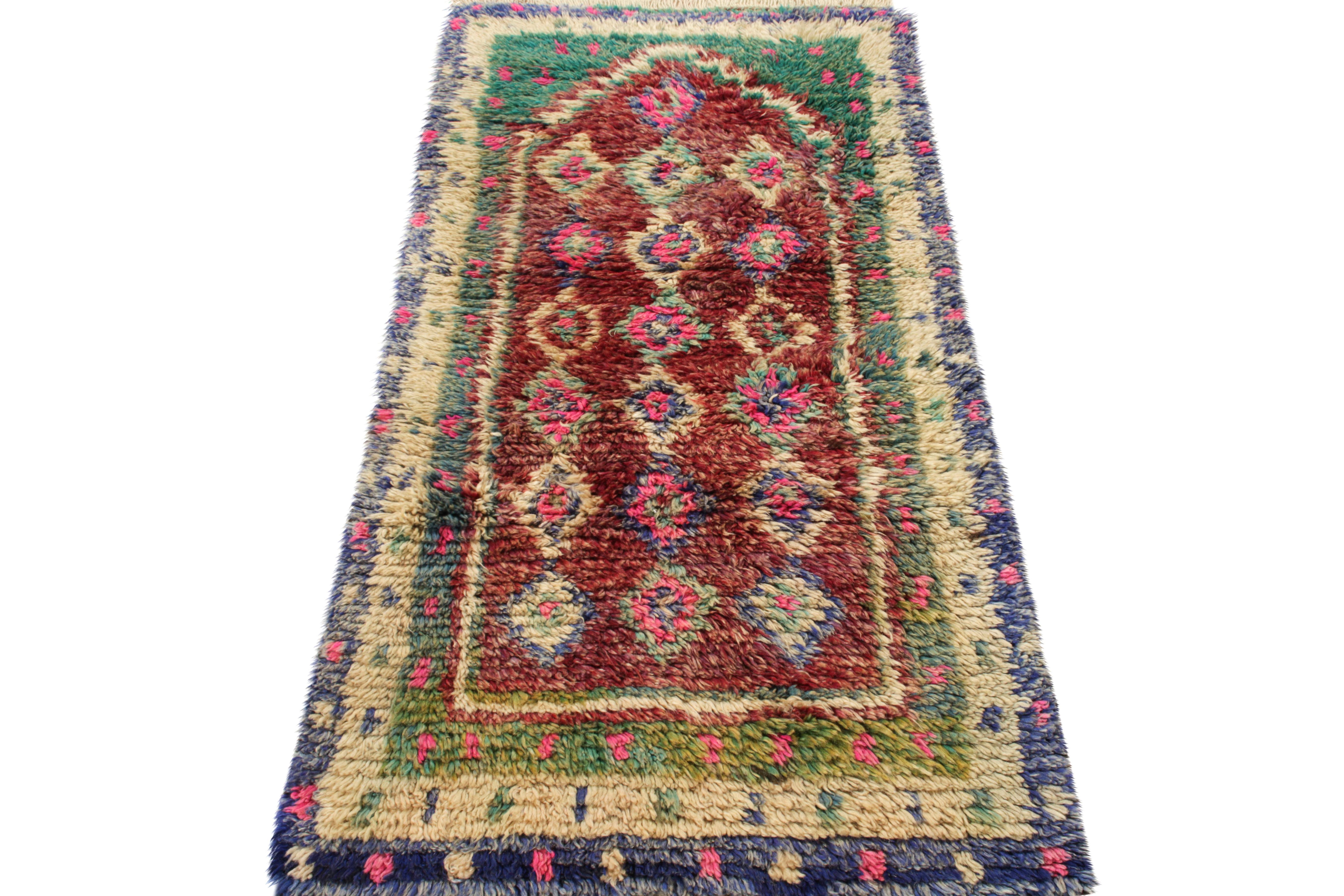 Hand-knotted in lush, quality wool circa 1950-1960, this 3x5 Turkish vintage Tulu rug enjoys the ruggedness of nomadic patterns in an unusual multicolor pattern—seldom seen in this lineage before with this particular, almost Moroccan tribal