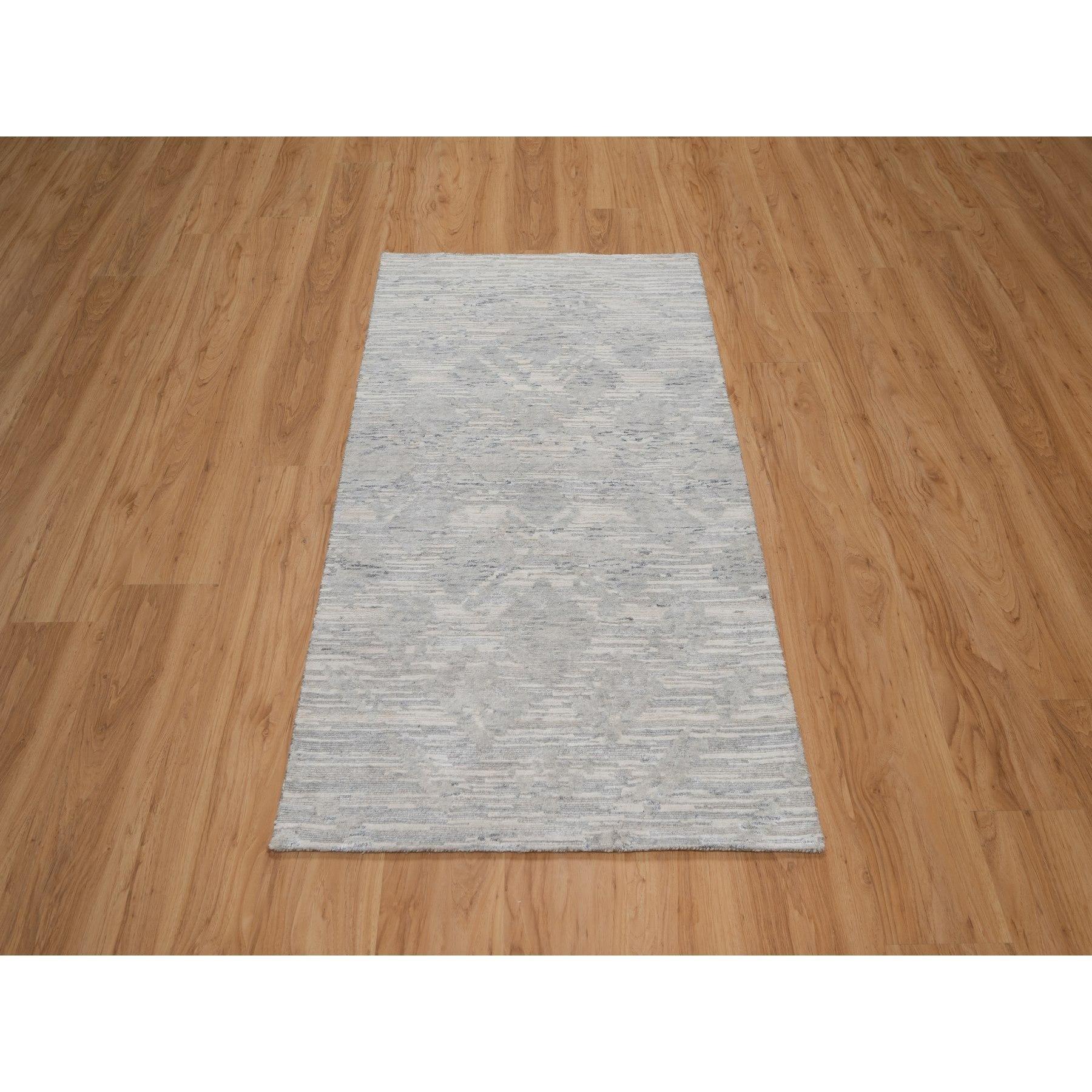 Cloud Gray, Modern Design, Hand Spun Undyed Natural Wool, Cut and Loop Pile, Hand Knotted, Oriental Rug
Primary materials: Wool
Latex: No Pile 
height: 0.25 Inches
Style: Contemporary
Primary color: Grey
Secondary colors: Ivory, Cream
Pattern: