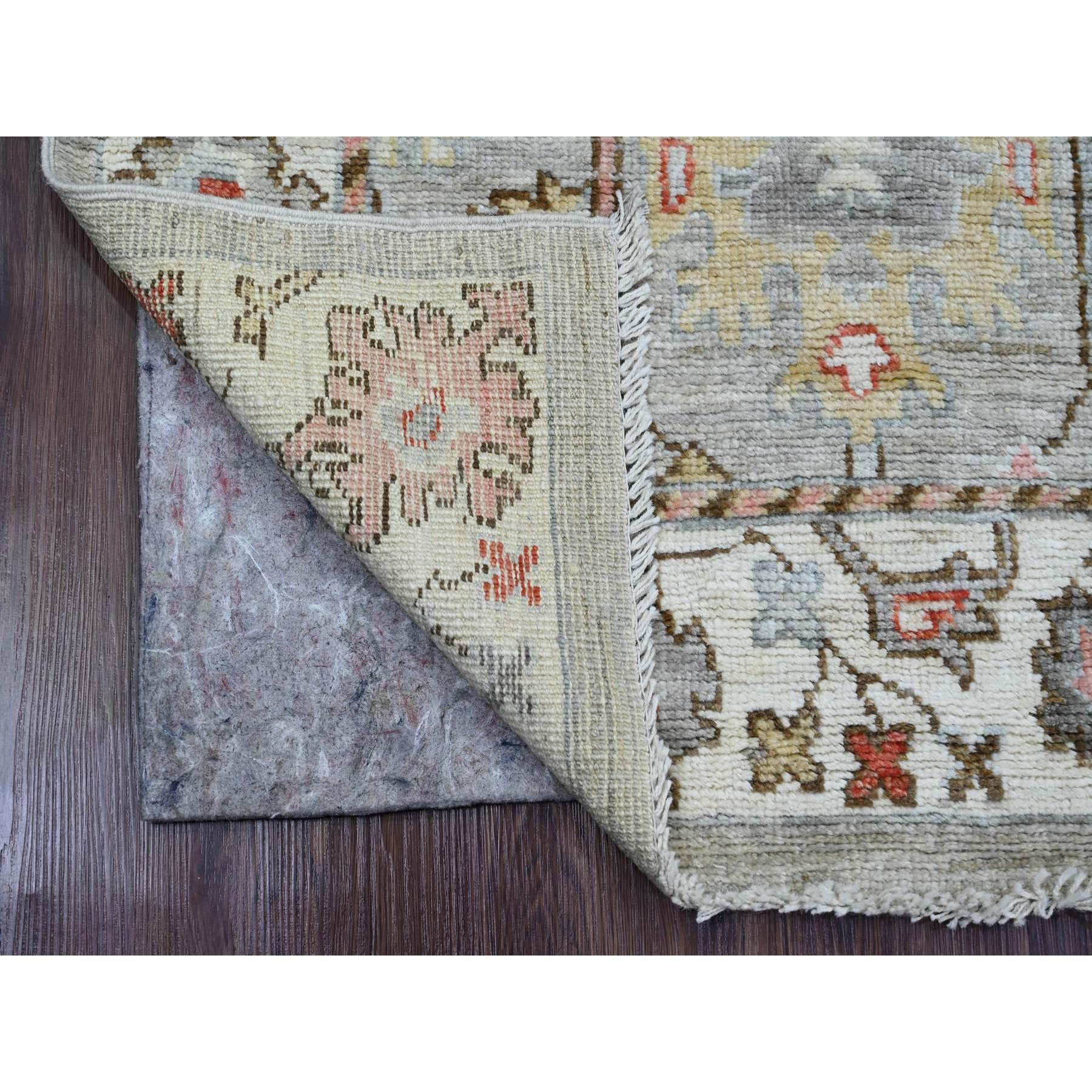 Coin Gray, Afghan Angora Oushak with Floral Motifs, Hand Knotted, Veggie Dyes, Pure Wool, Runner, Oriental Rug
Primary materials: Wool 
Latex: No Pile 
height: 0.25 Inches
Style: Transitional
Primary color: Grey
Secondary colors: Red, Pink, Yellow,