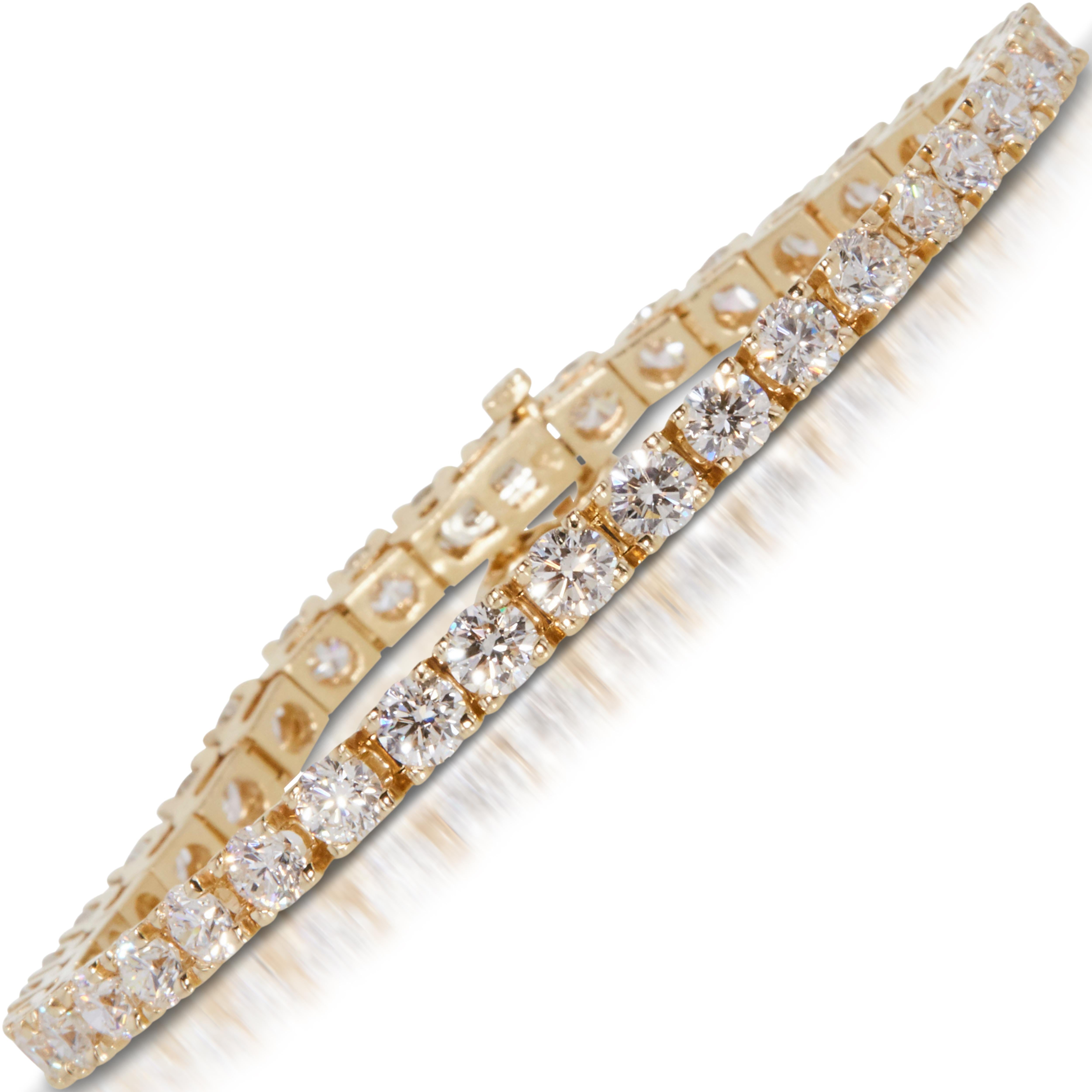 Classic 4 1/2 carat round natural diamond tennis link bracelet in 14k yellow gold. 67 round brilliant natural diamonds (natural earth-mined) are hand set in this diamond tennis bracelet weighing approx. 4 1/2 carats.


This approx. 4 1/2 carat