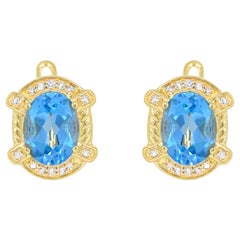 4-1/2 ct. Boucles d'oreilles suisses en or sur argent sterling, topaze bleue et diamant blanc 