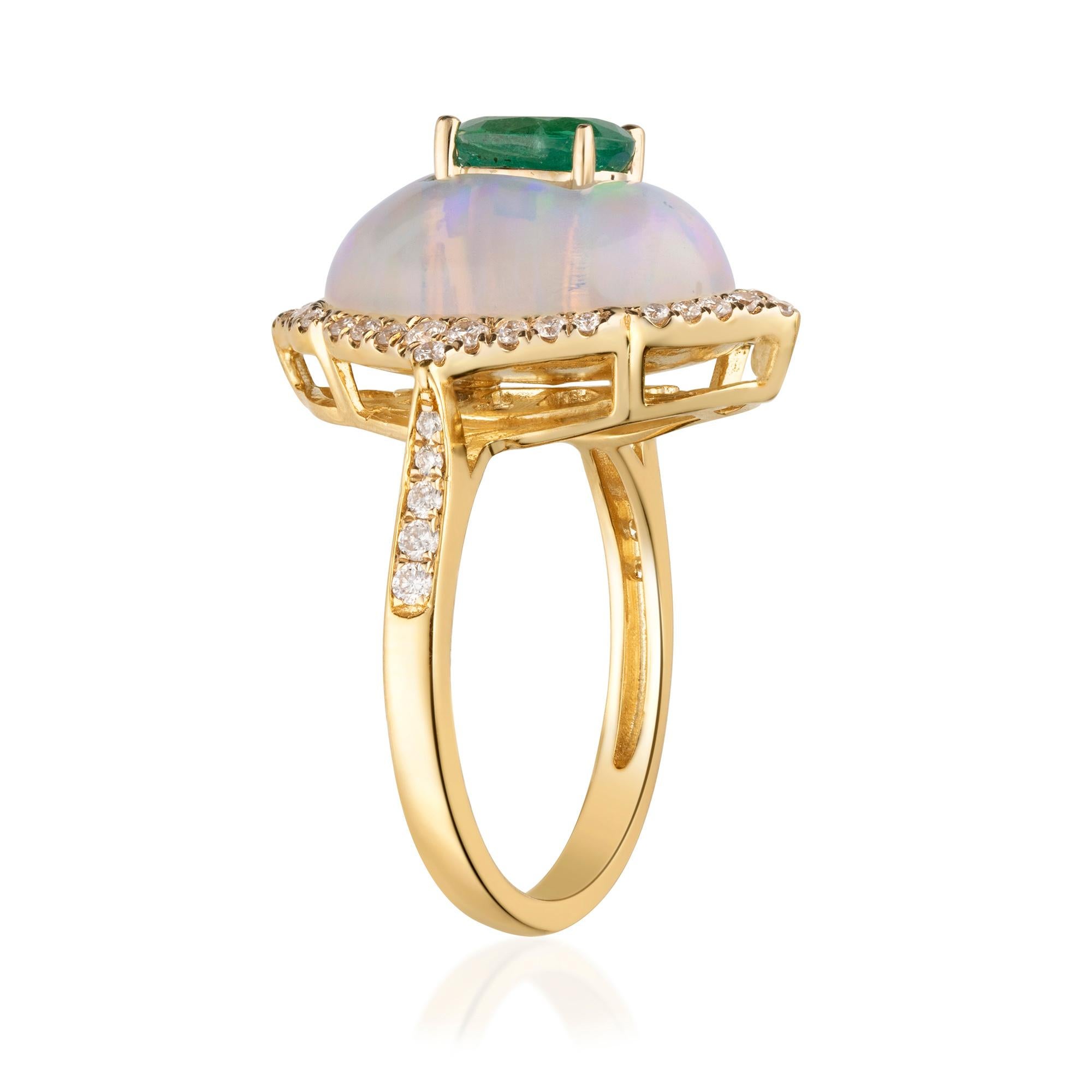 This beautiful Emerald Ring is crafted in 14-karat Yellow gold and features a 4/5 carat 1 Pc Natural Emerald, 1 Pc Opal 5.63 Carats and  46 Pcs Round White Diamonds in GH- I1 quality with 0.35 Ct in a prong-setting. This Ring comes in sizes 6 to 9,