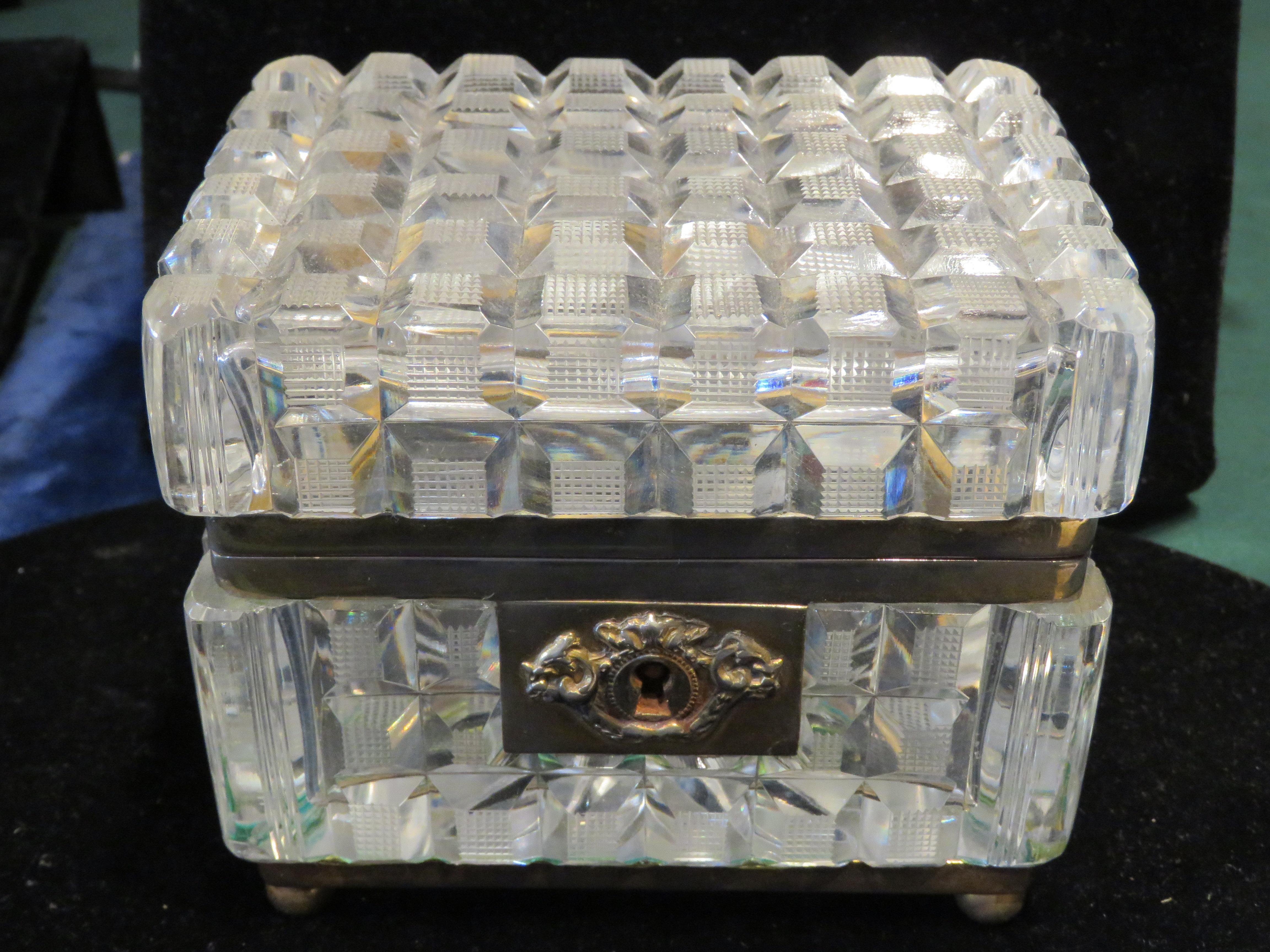 
A Rare Beautiful 19th Century Bacarrat Style Antique Hand Cut Hinged Lidded French Crystal Box Gilt Bronze Mounted Cut Crystal Box. The rectangular hinged lid and sides centering deeply cut bands of flat topped rectangular details within diamond
