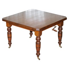 Antique 4-6 Person Victorian Mahogany Wind Out Dining Table with Porcelain Castors