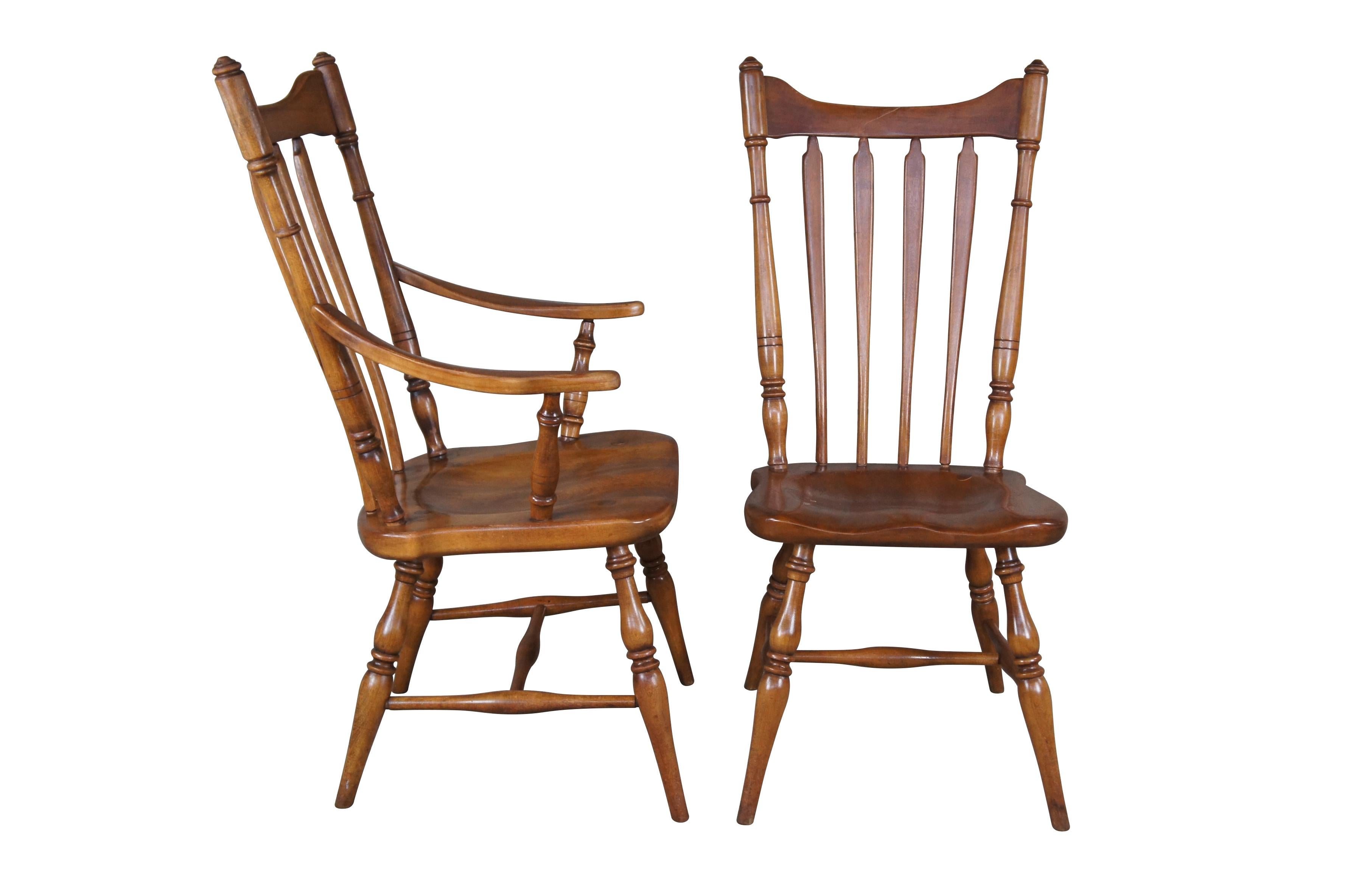Set of four Cushman Colonial Creations dining chairs.  Crafted from maple featuring slatted backs and turned tapered posts.  One armchair, three side chairs.  5921.

The H.T. Cushman Manufacturing Company was founded in 1886 and spent close to 100