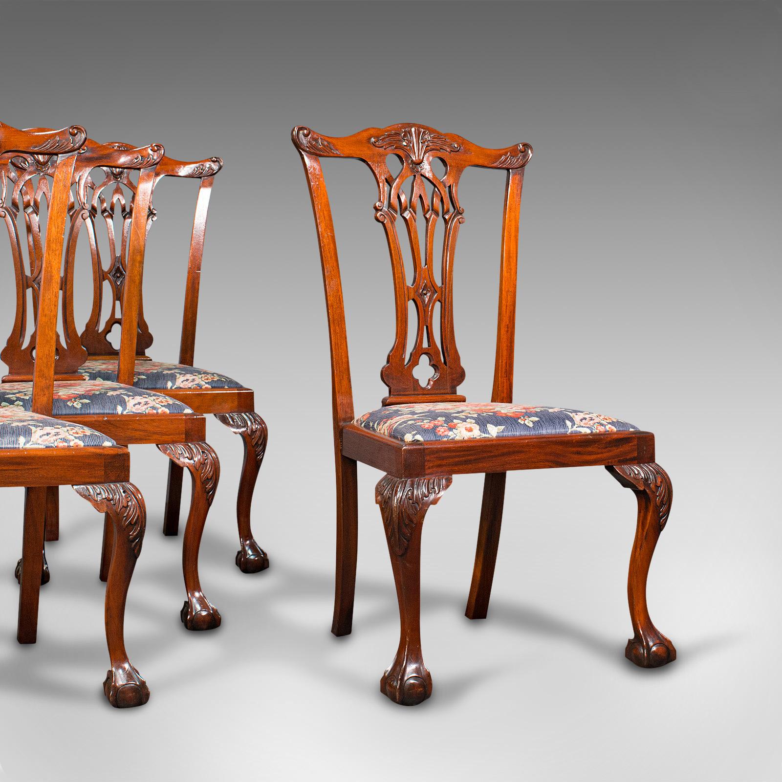 This is a set of 4 antique dining chairs. An English, quality mahogany seat in the manner of Chippendale, dating to the late Victorian period, circa 1900.

A suite of striking colour and fascinating detailing
Displays a desirable aged patina and