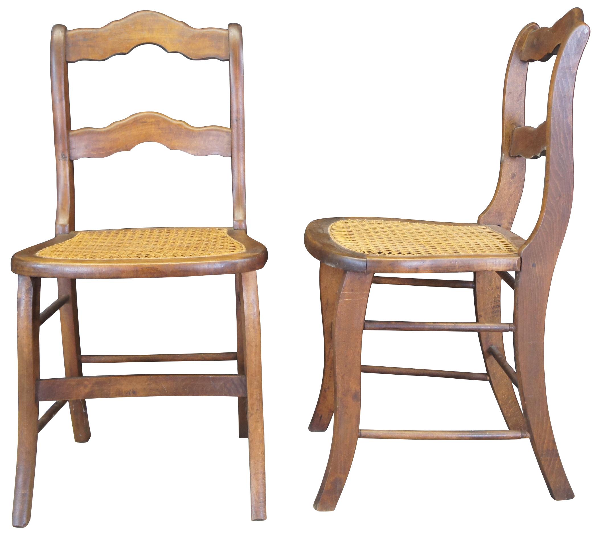 Set of 4 late Victorian side chairs. Made from oak with a contoured ladderback and cane seat. 

Measures: 20