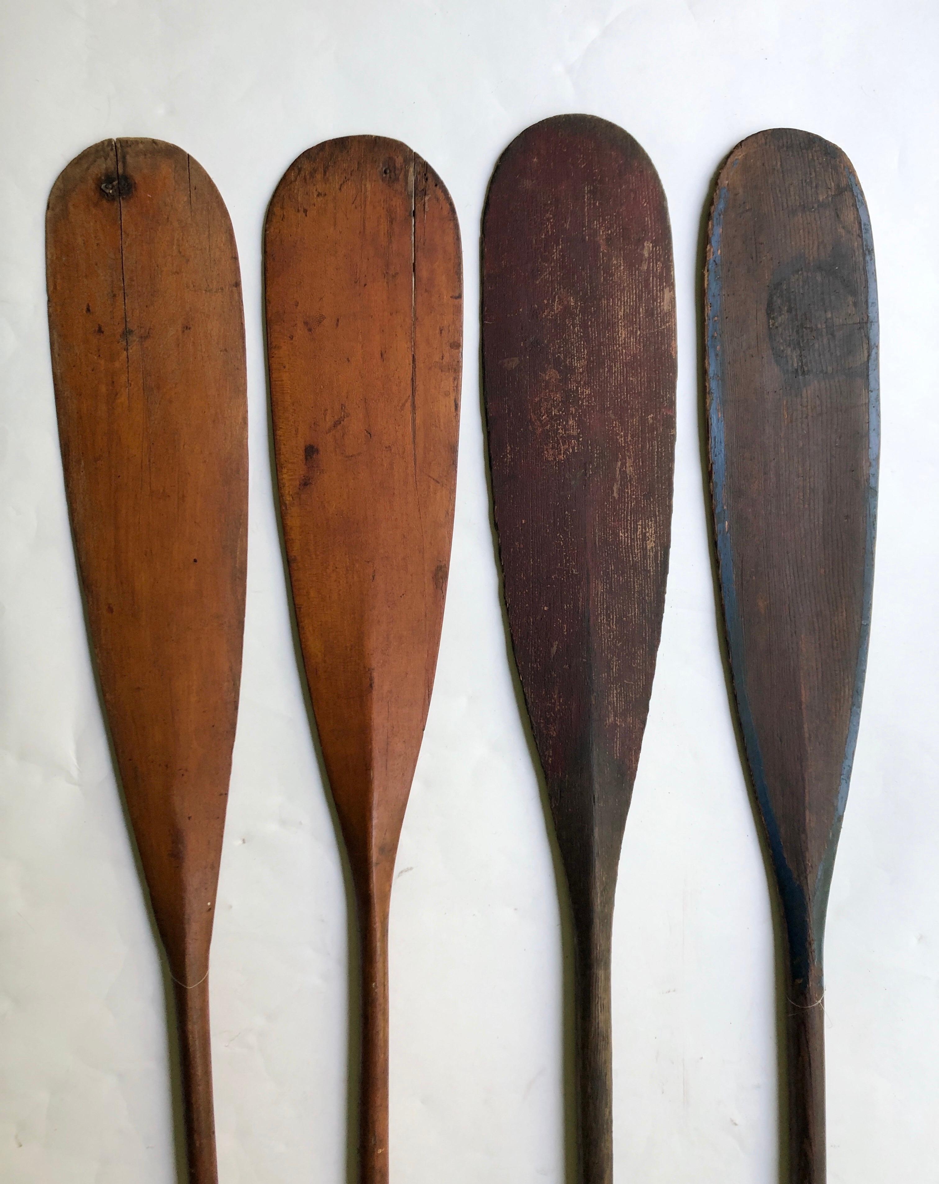4 antique wooden canoe paddles. Untouched original surface. Great display for a summer or beach house. They measure 58