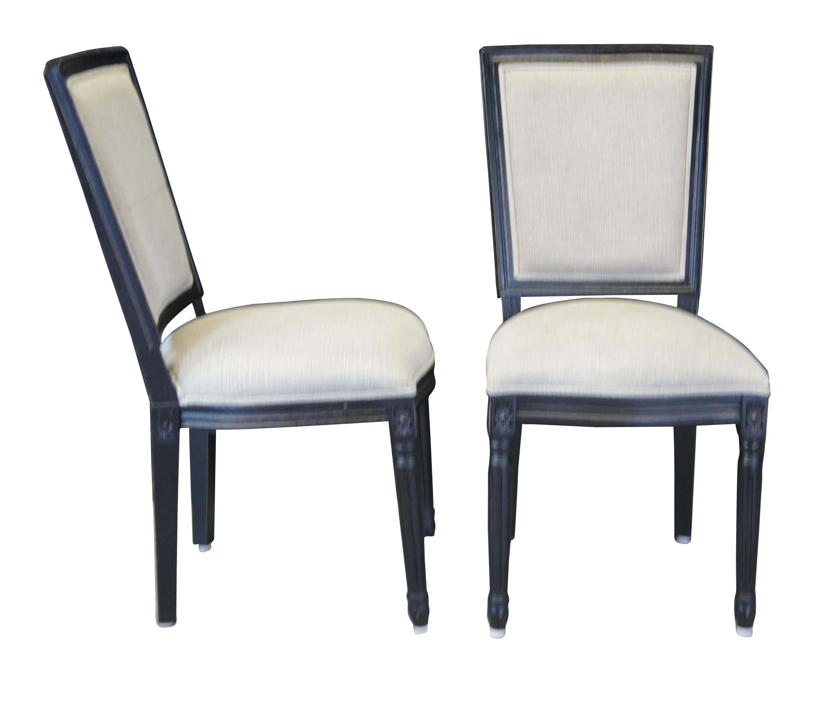 4 Ahaus Adele Upholstered Oak Dining Chairs, finished in black with gray fabric. The black finish has been discontinued and is a rare find.

Inspired by the dark yet dignified grandeur of 18th century neoclassical masters, the Adele Dining Chair