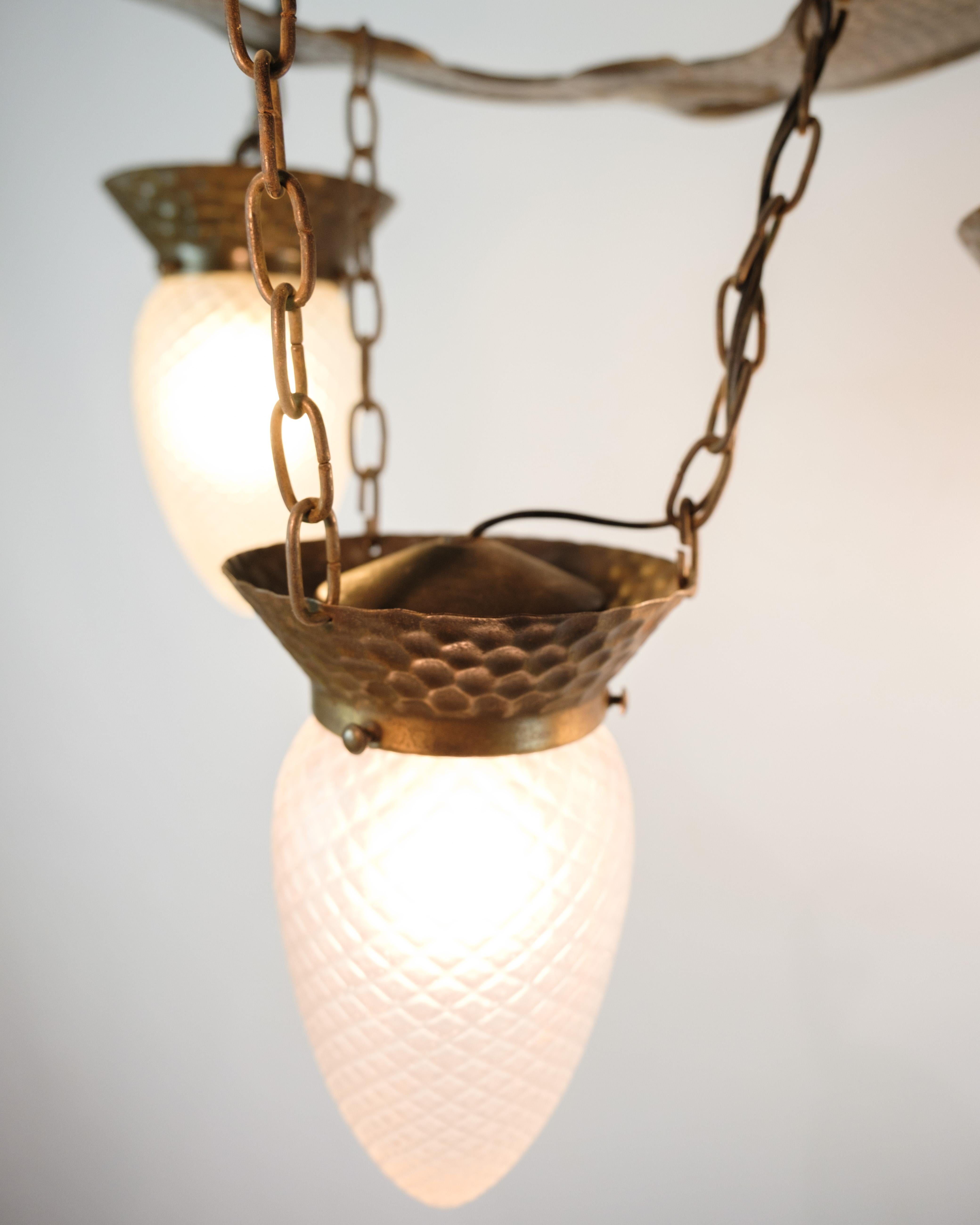 4 Armed Art Nouveau Chandelier In Patinated Hammered Brass & Teardrop Glass In Good Condition For Sale In Lejre, DK
