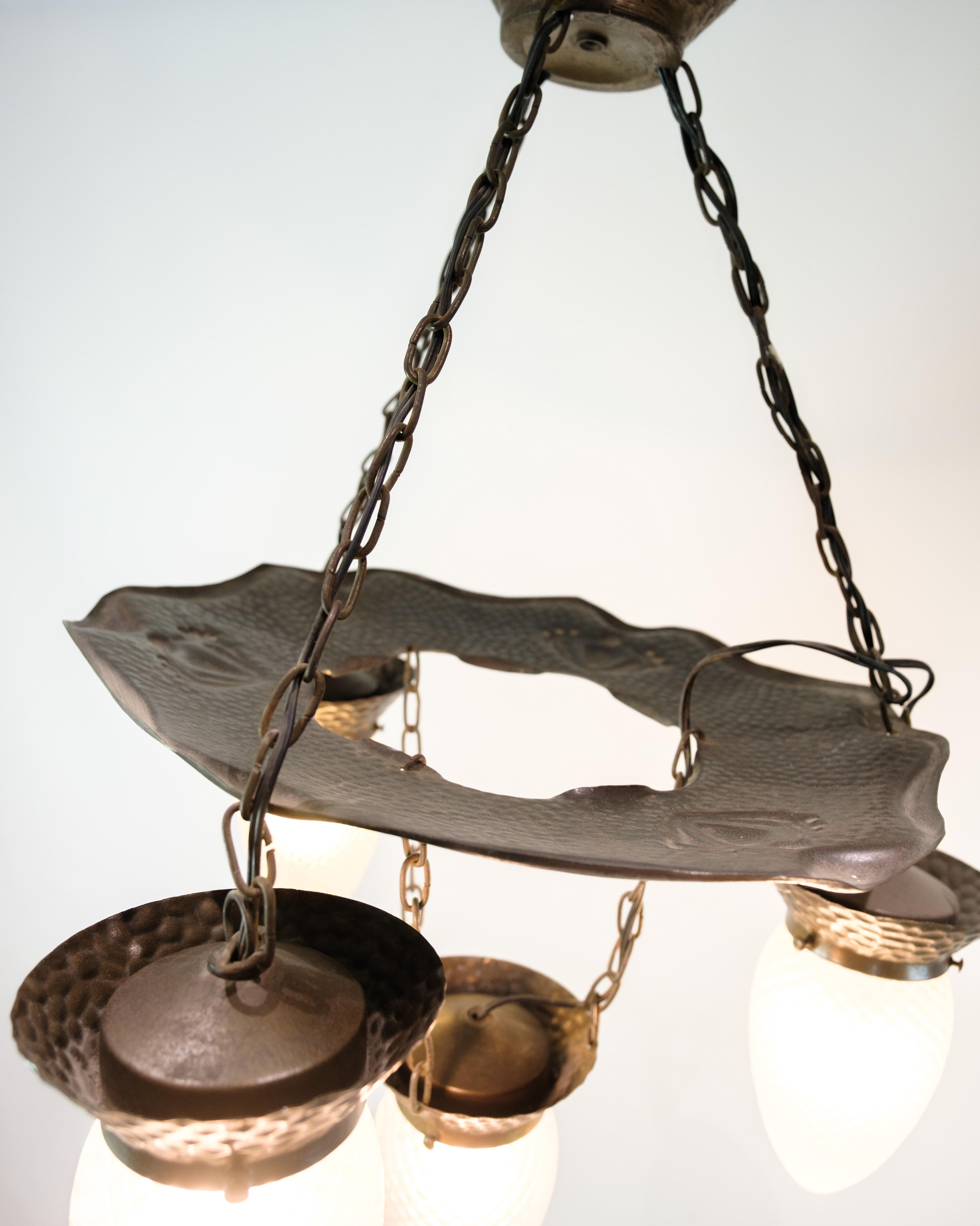 Early 20th Century 4 Armed Art Nouveau Chandelier In Patinated Hammered Brass & Teardrop Glass For Sale