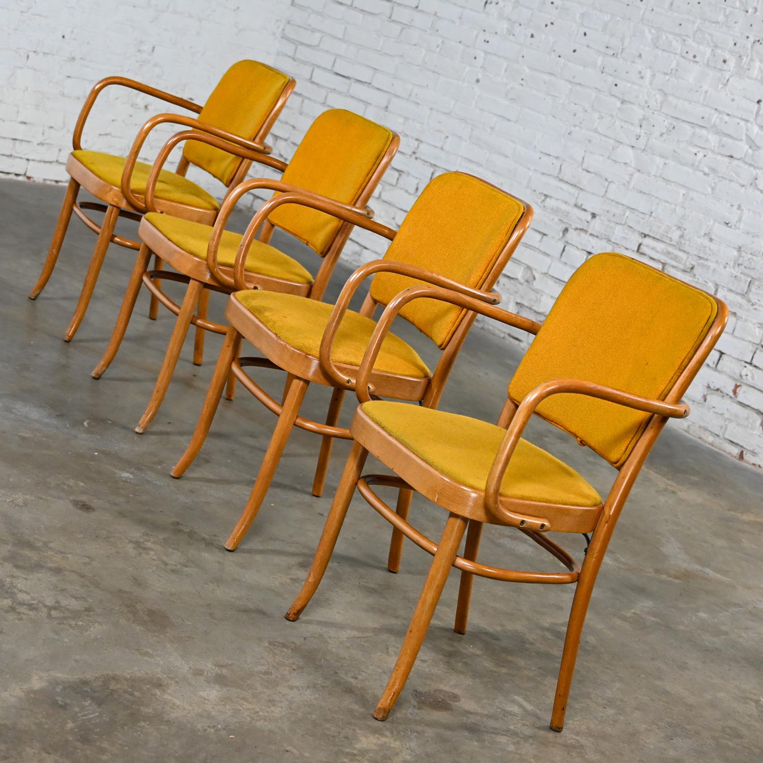 Wonderful vintage Bauhaus beech bentwood frame Thonet Josef Hoffman Prague 811 style armed dining chairs by Falcon Products Inc., Set of 4. Beautiful condition, keeping in mind that these are vintage and not new so will have signs of use and wear
