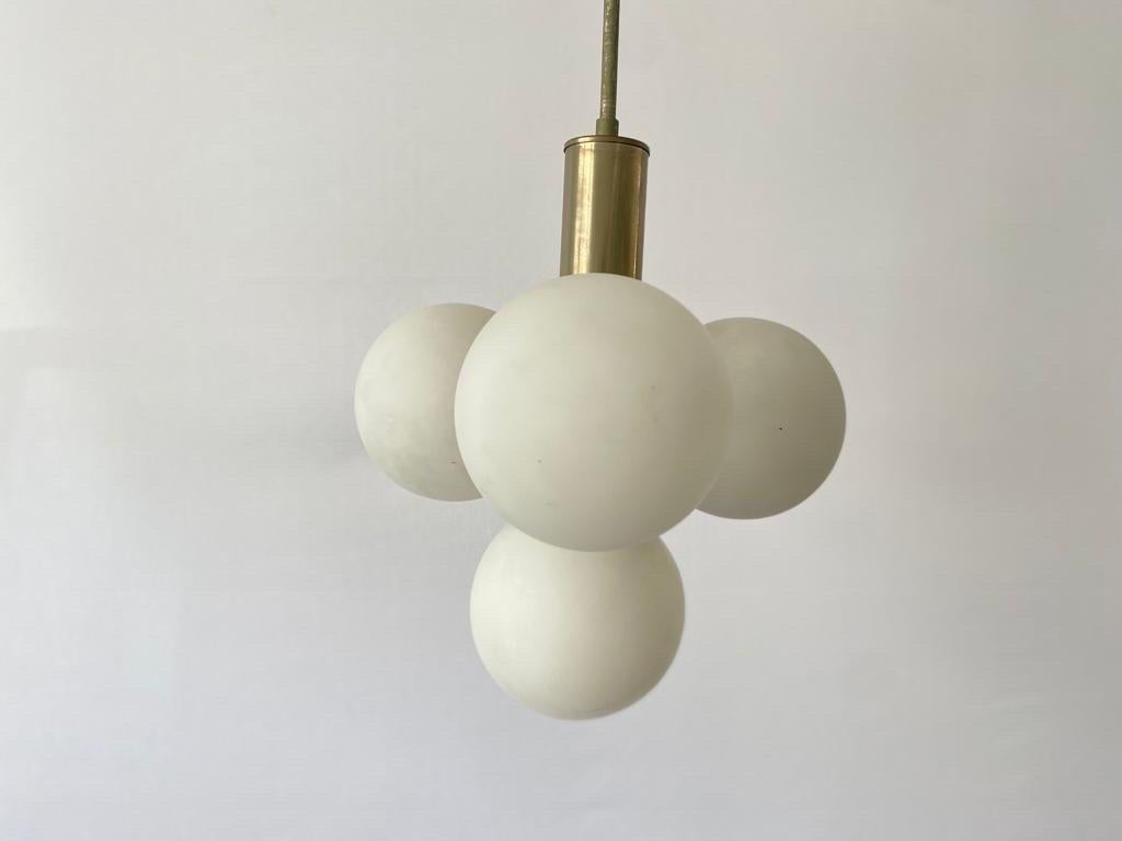 4 Ball Glass Ceiling Lamp, 1970s, Germany

Lampshade is in good condition and very clean. 
This lamp works with 4 x E14 light bulb. 
Wired and suitable to use with 220V and 110V for all countries.

Measurements:
Height: 58 cm
Shade height: 32