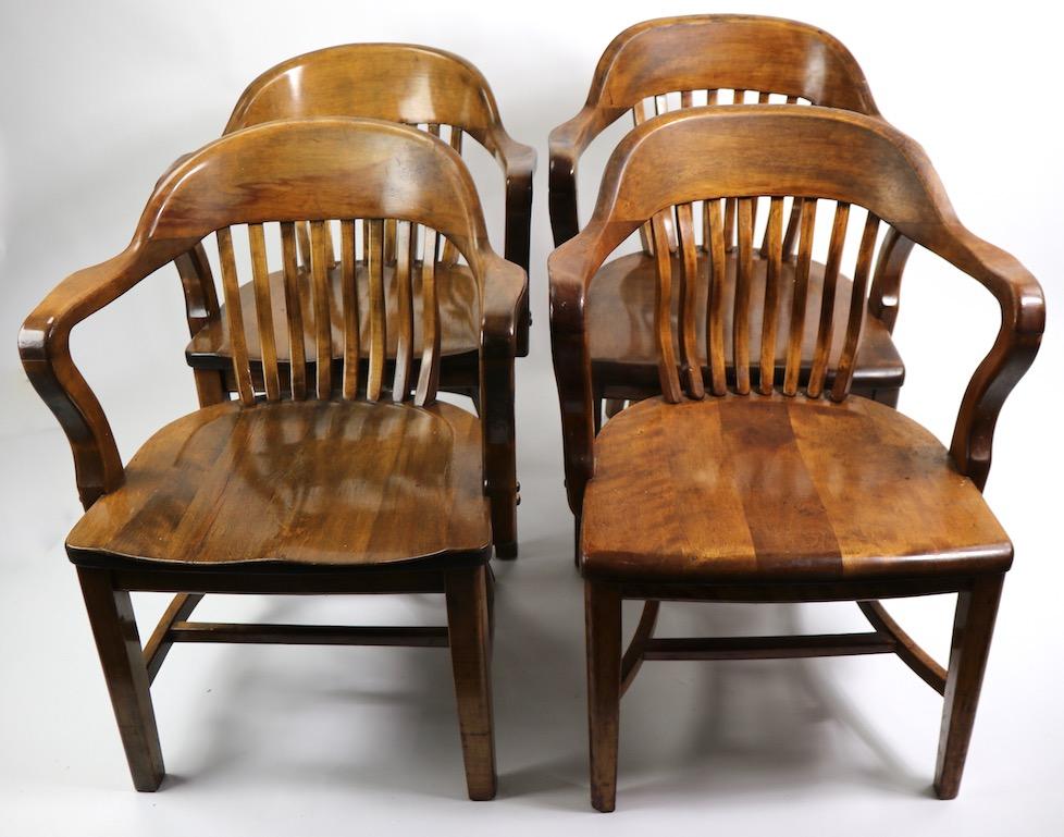Nice set of two vintage office chairs often referred to as bank of England or Yale Library chairs, probably by Gunlocke. 
2pc - 29.5 TH x Seat H 15 x 24 W x 20 D.
Originally designed for use as office, conference, work or waiting room chairs, these