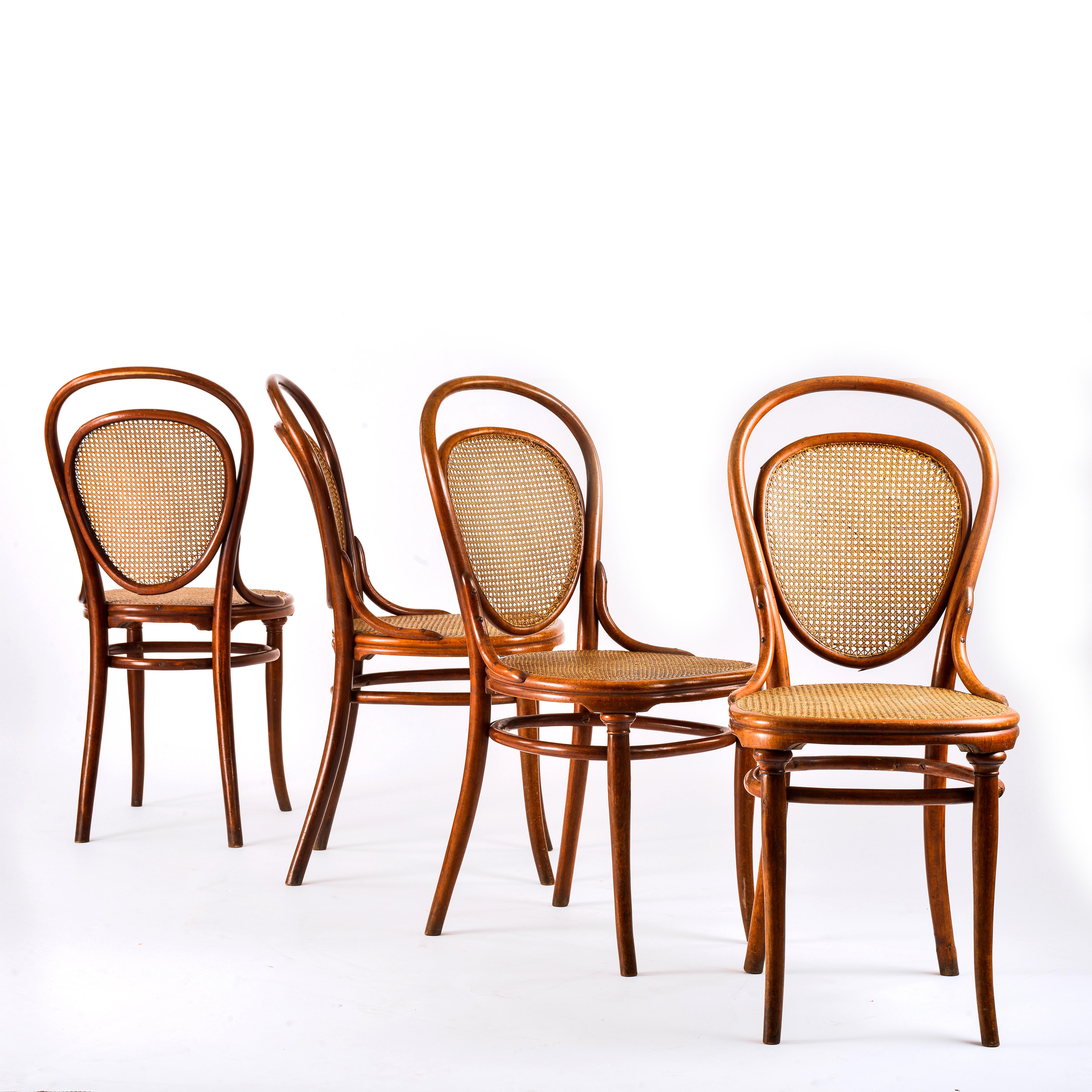 Suite of 4 chairs, number 7, published by Thonet at the end of the 19th century. Curved and stained beech wood typical of the manufacture's production, top of the front legs molded, caned seat and openwork back with oval panel also caned. Presence