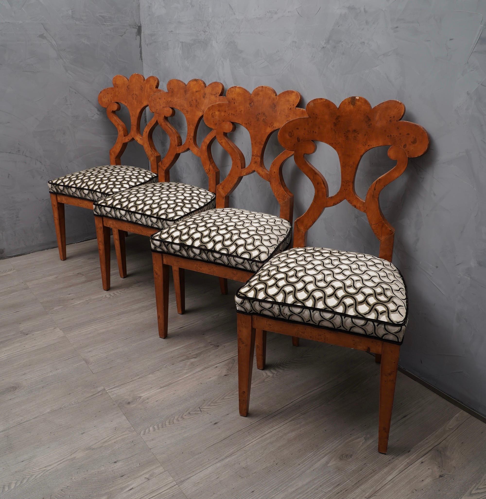 Spectacular Biedermeier chairs with a unique and original design, a precursor style of the times still current today.

The four chairs are veneered in poplar briar wood, have a rich backrest in the shape of daisy petals, which is what characterizes