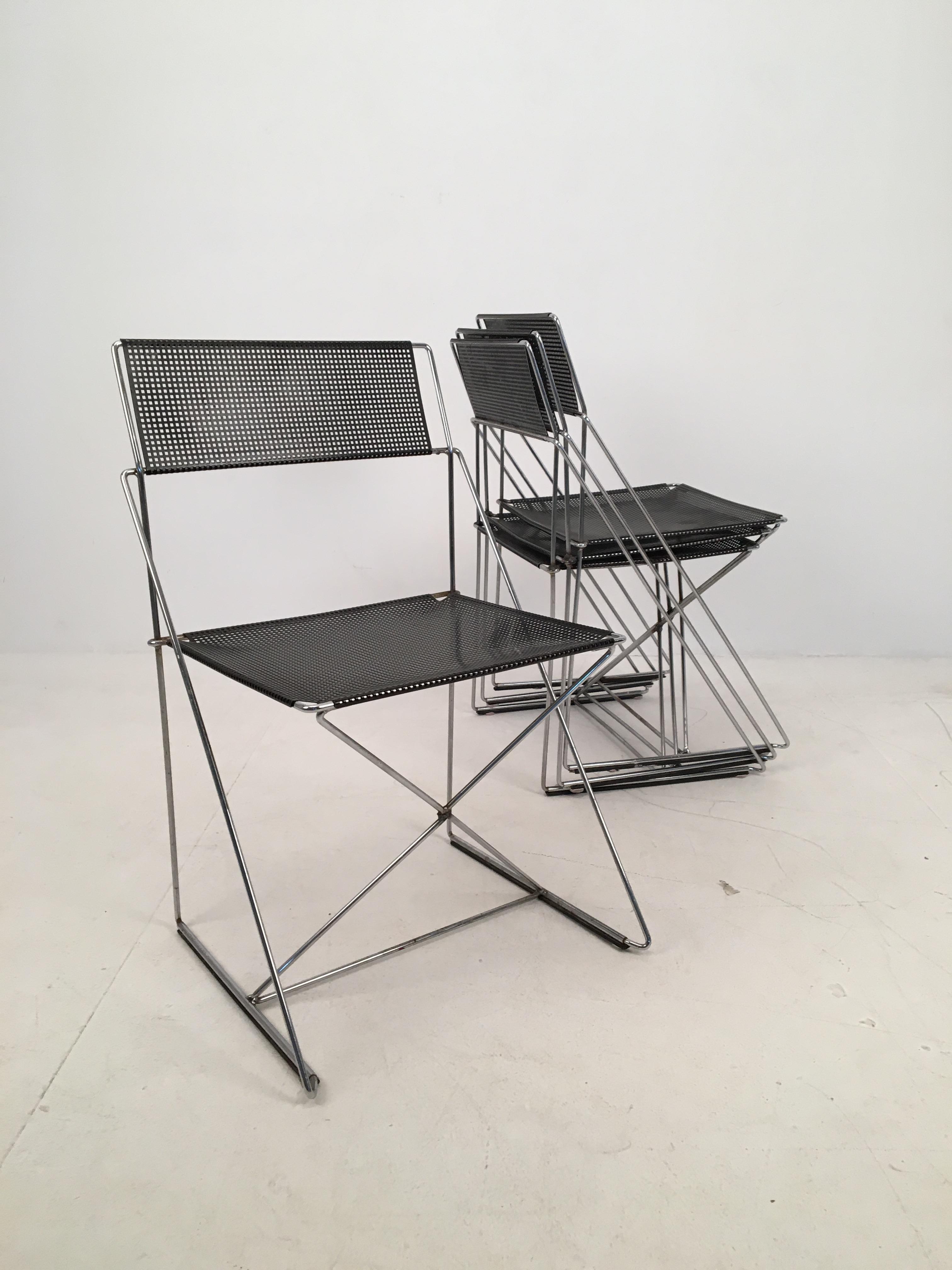 Set of 4 Mid-Century Modern ‘X-Line’ metal stacking chairs designed by Niels Jørgen Haugesen and produced by Hybodan in Copenhagen, Denmark, circa 1970.

Industrial meets Postmodern meet Minimalist, these chairs are very sculptural in appearance