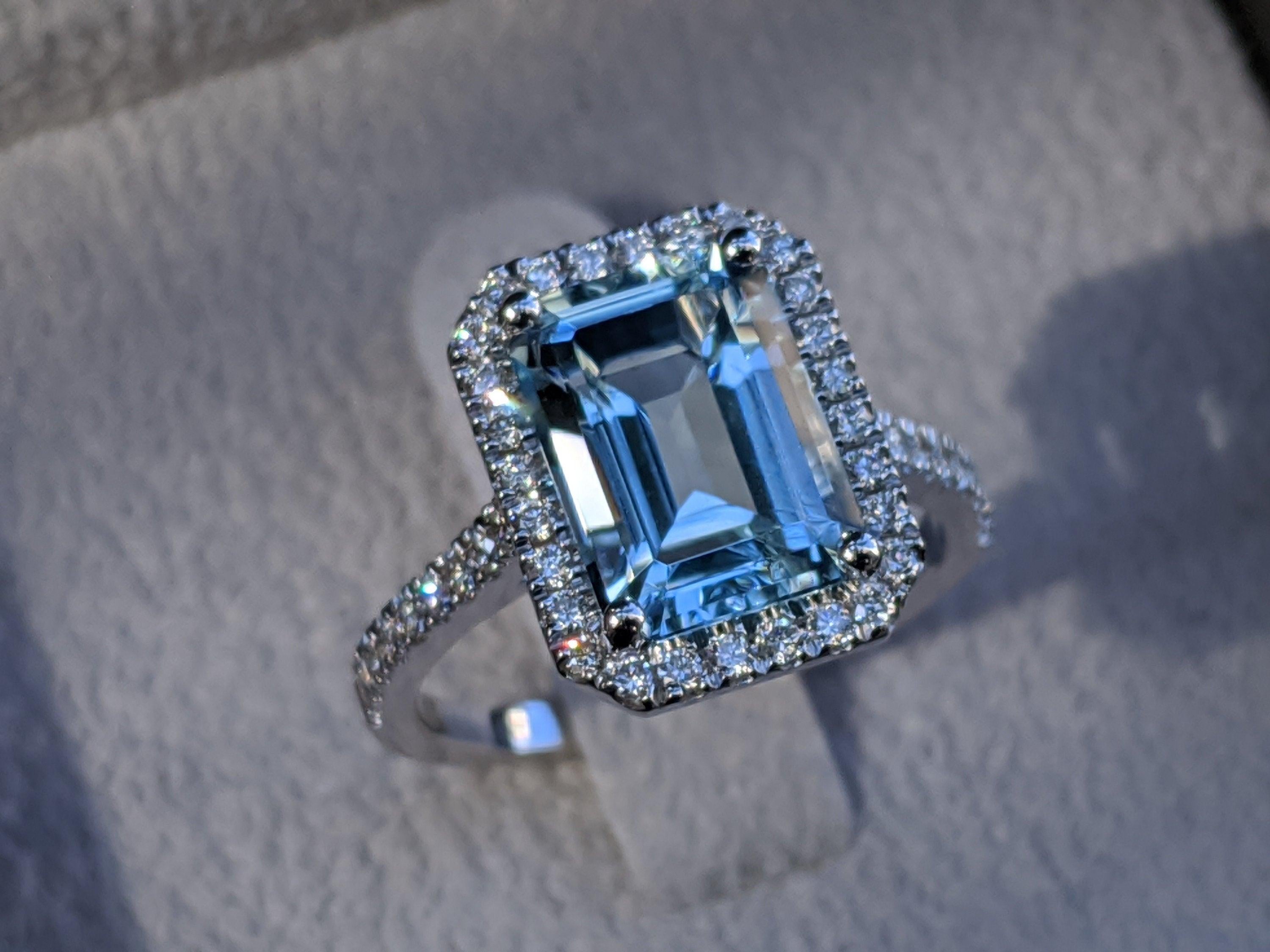 A beautiful handmade engagement ring made of 14K White Gold set with a large natural, light blue aquamarine accompanied with 0.5 total carat weight natural diamonds.
 
 Aquamarine Details
 Main Stone: Emerald Cut Aquamarine
  Color: Light Blue
 