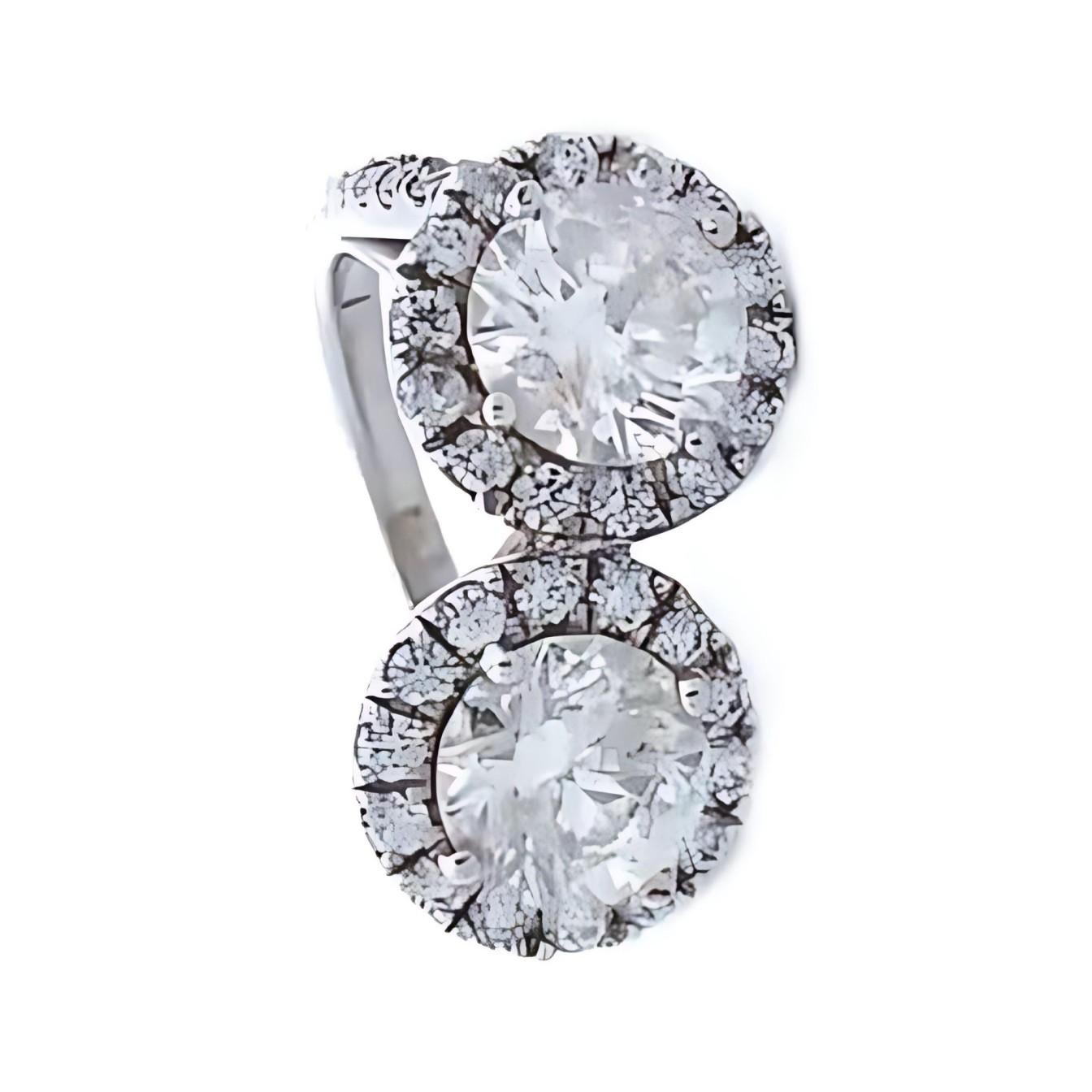 Quality, at the right price. This stunning designer 2-stone ring showcases two brilliant round diamonds as the focal point, together totaling 3.15 carats. Surrounding the center stones are additional round-cut diamonds that enhance the sparkle and