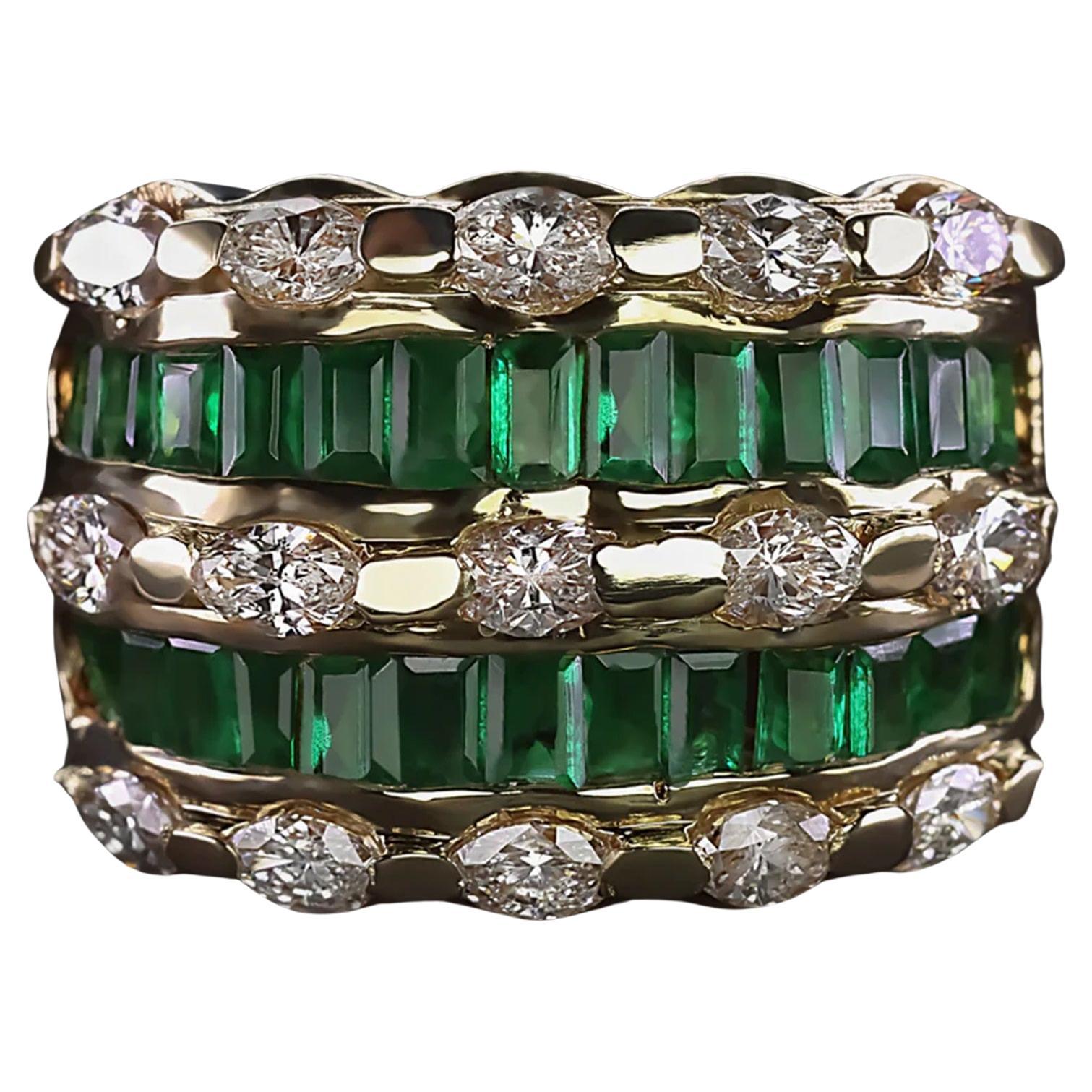 Indulge in the opulence of this striking wide band, beautifully crafted with a combination of sparkling marquise cut diamonds and vivid green emeralds. This luxurious ring is a true statement piece, offering both captivating color and radiant