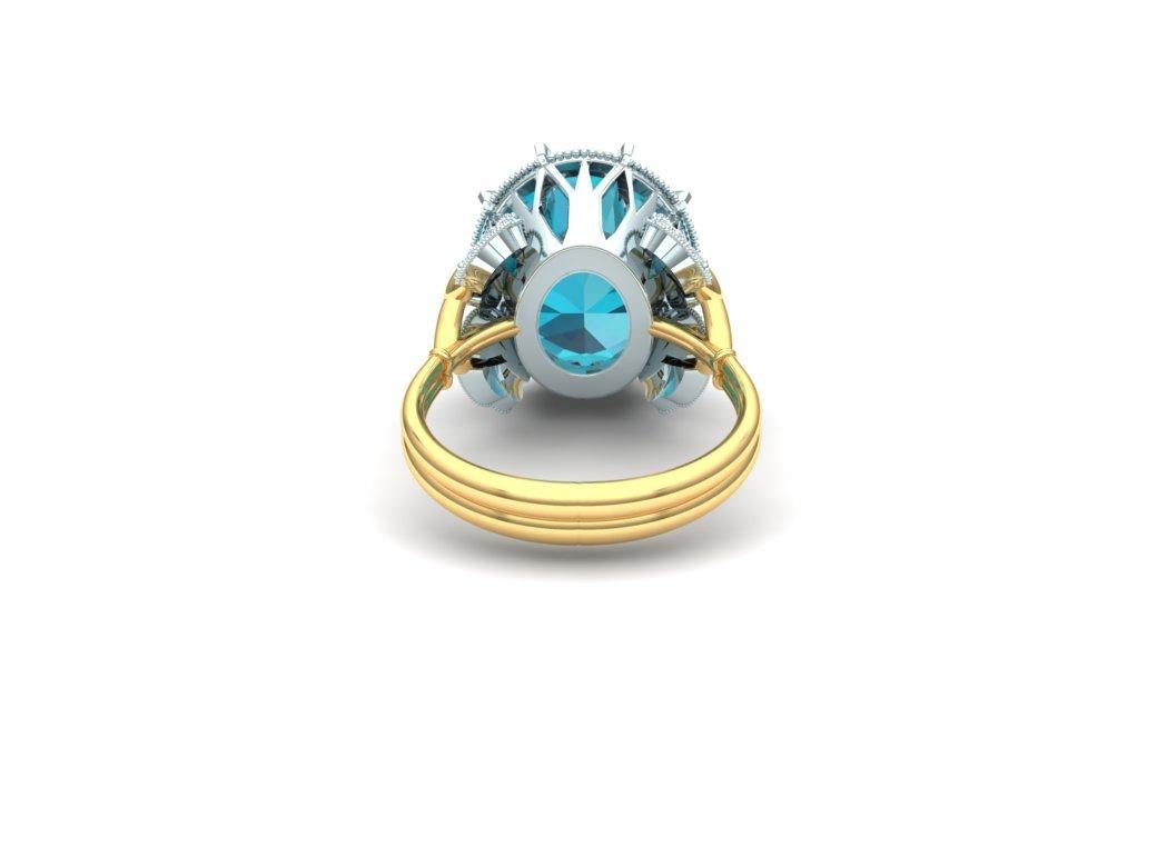 This stunning and organic looking ring has a 3 carat blue green oval cut Apatite which emulates that colors of the rare and very expensive Paraiba Tourmaline.  This is a smart ring to get the look of spending in the mid five figures for that of a