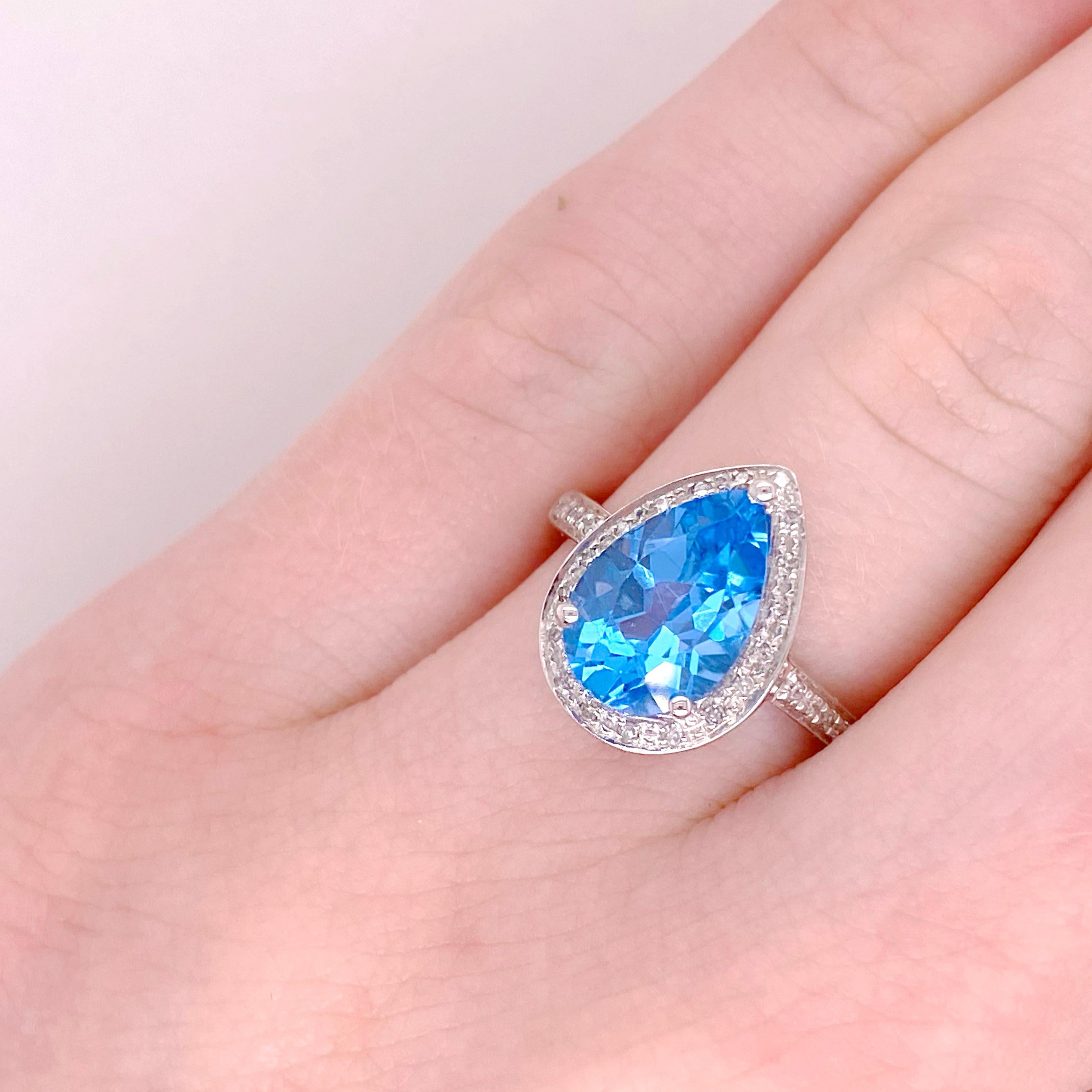 Metal Quality: 14 kt White Gold 
Diamond Number: 28
Diamond Total Weight: .12 carat 
Diamond Clarity: VS2 (excellent, eye clean)
Diamond Color: G (excellent, near colorless)
Diamond Shape: Round Brillant 
Gemstone: Blue Topaz
Gemstone Weight: 3.77