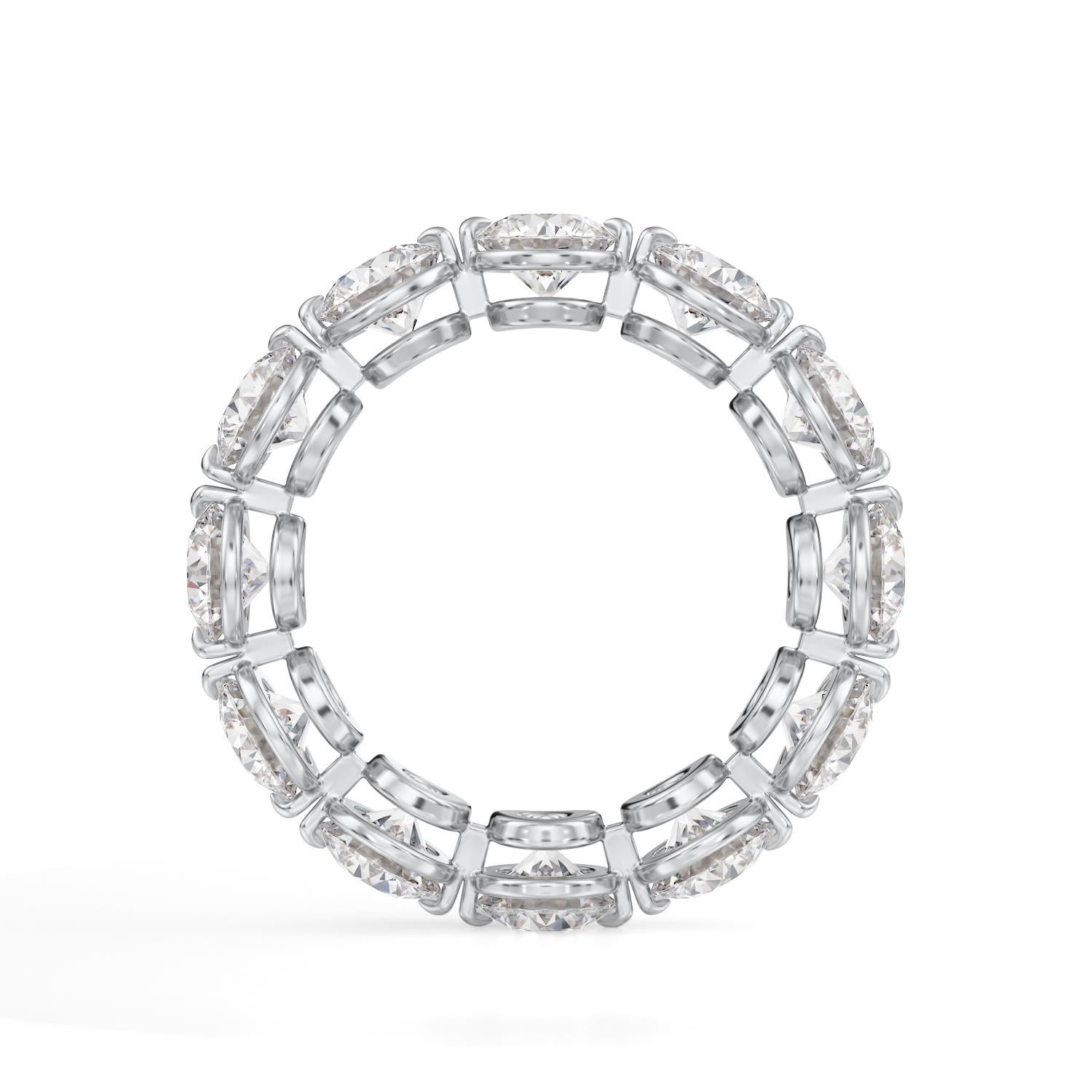 Diamond Eternity Band set in Platinum. 12 Round Brilliant diamonds are E-F VS1-SI1. Carat weight: 4ct. Total ring weight 5.2grams. Ring size: 5. Can be sized upon request. This ring is customizable, price may vary depending on modifications such as,