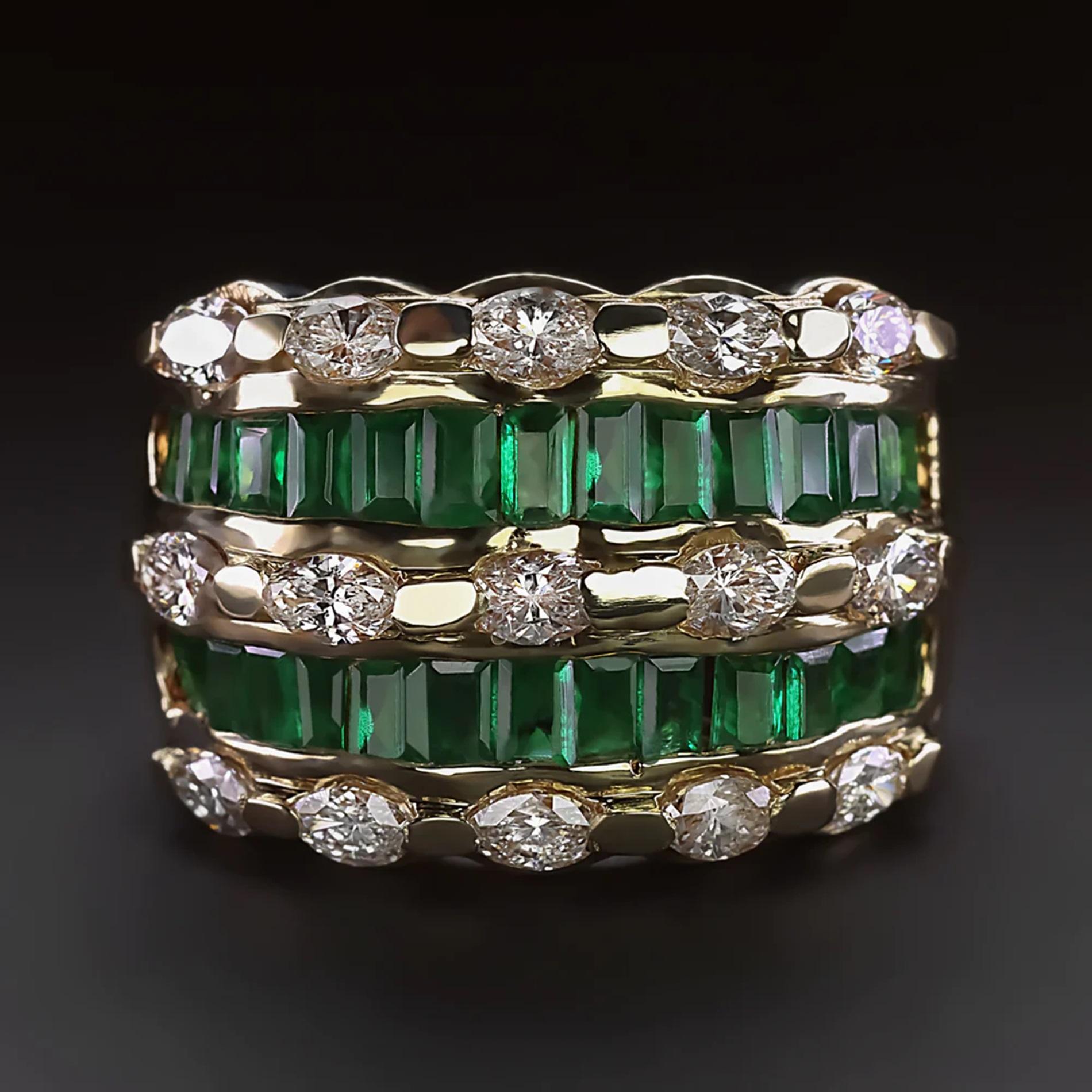 This wide diamond and emerald band offers a luxurious, eye catching look with rich color and bright sparkle!

Highlights:

- 1.50 carat of beautifully white and eye clean marquise cut diamonds

- 2.50 carats of natural, rich green emeralds

- Very