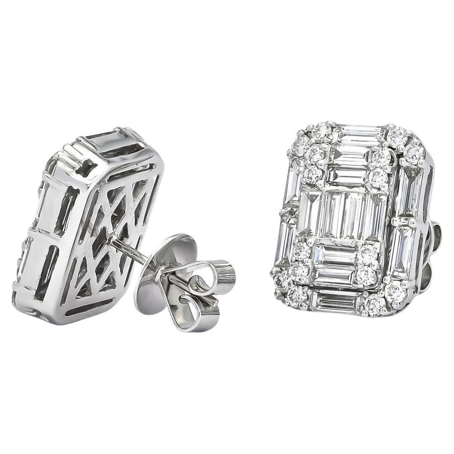 An exquisite pair of earrings set in 18 carats white Gold 
set with natural earth mine diamonds with Baguette and Round Brilliant cuts with  F-G color and VVS clarity