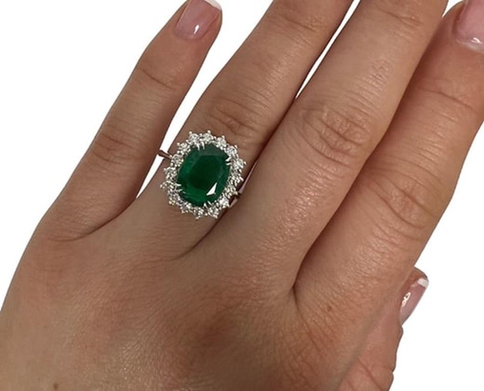 Emerald Weight: 4.01 CTs, Measurements: 11x9 mm, Diamond Weight: 0.72 CTs (2.2mm), Metal: 18K White Gold, Gold Weight: 5.70 gm, Ring Size: 7, Shape: Cushion, Color: Green, Hardness: 7.5-8, Birthstone: May