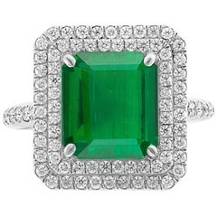 Antique 4 Carat Emerald Cut Colombian Emerald and Diamond Platinum Ring Estate