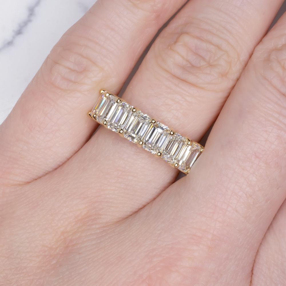 Embark on a journey of bespoke elegance with our exquisite 18K Yellow Gold Emerald Cut Diamond Full Circle Band, a celebration of timeless love and enduring beauty.

Customization Options:
This captivating ring, adorned with 8 natural emerald-cut