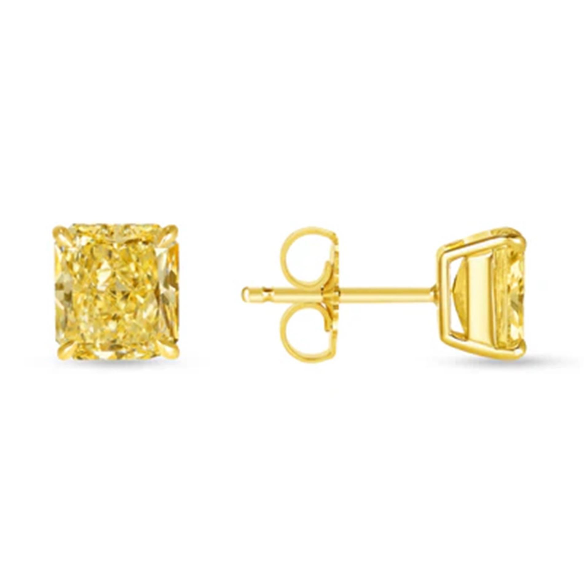These exquisite stud earrings showcase a vibrant pair of GIA-certified radiant cut diamonds, each weighing 2.01 carats, for a total carat weight of 4.02. Graded Fancy Intense Yellow with excellent or very good symmetry and clarity ranging from VS2