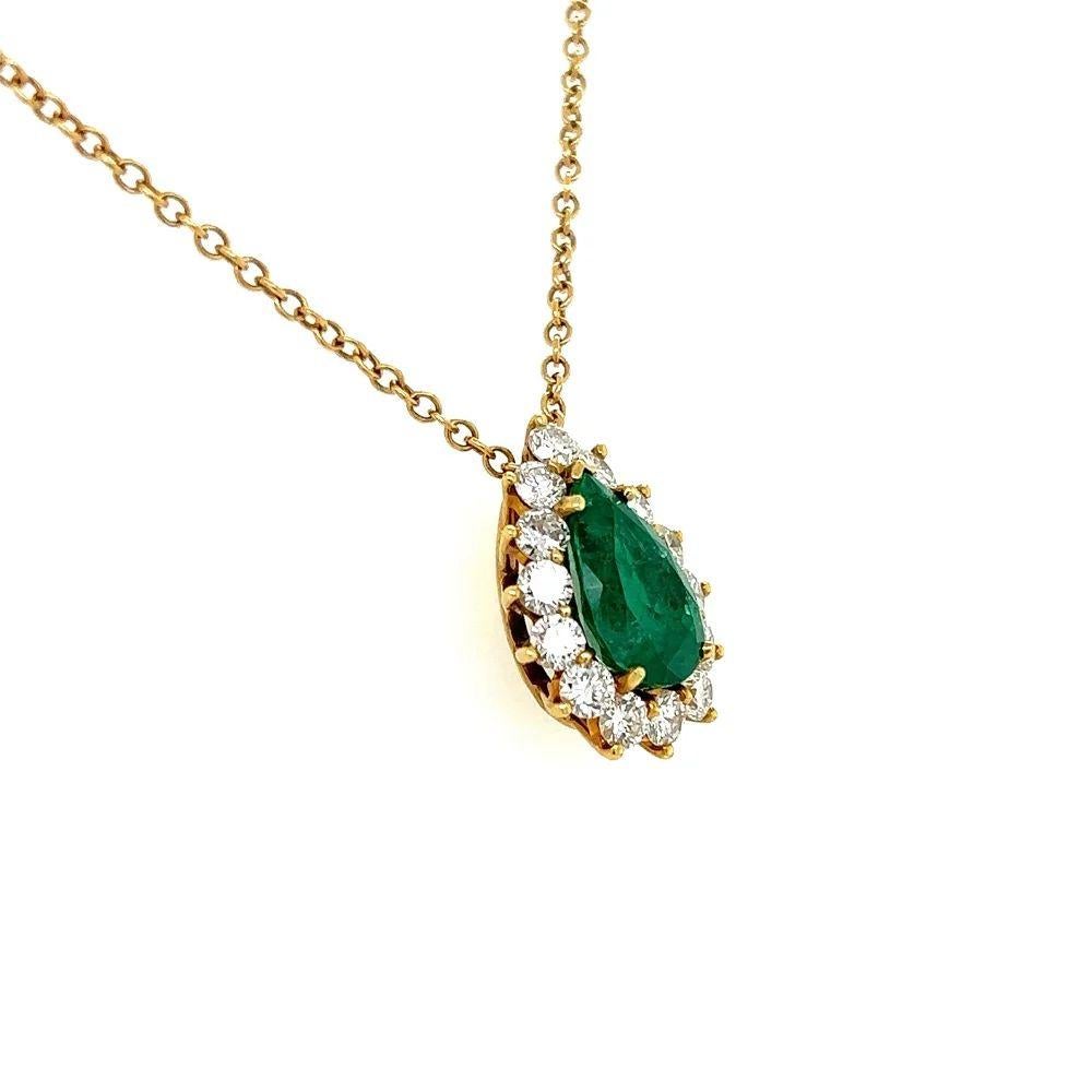 Simply Beautiful! Elegant and finely detailed Necklace featuring a 4.00 Carat Pear shaped GIA Emerald Gemstone. GIA #2221857825. Surrounded by Diamonds weighing approx. 1.80tcw. Suspended from a 16” long 18K Gold chain. The necklace is in excellent