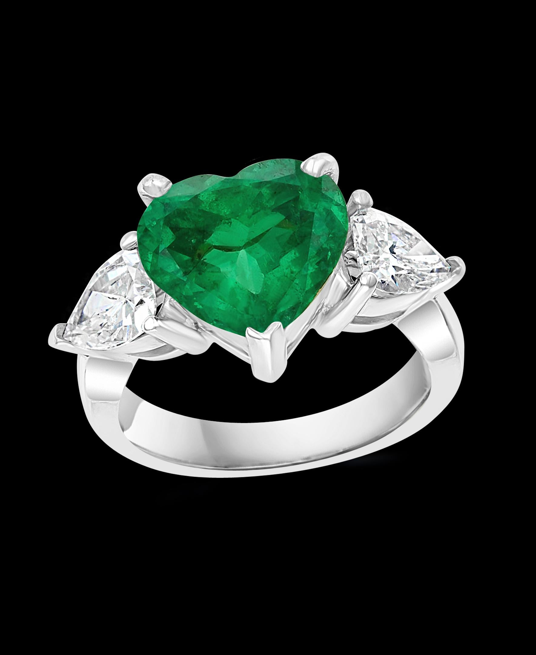 A classic, Cocktail ring , Perfect gift for Valentine's day !!
4 Carat Heart Shape Colombian Emerald & 1.3 Ct Diamond 18 Karat Gold Ring Estate
Gold: 18 Karat white gold , Weight: 8 gram
Two solitaire Pear shape diamond each approximately 0.7 ct