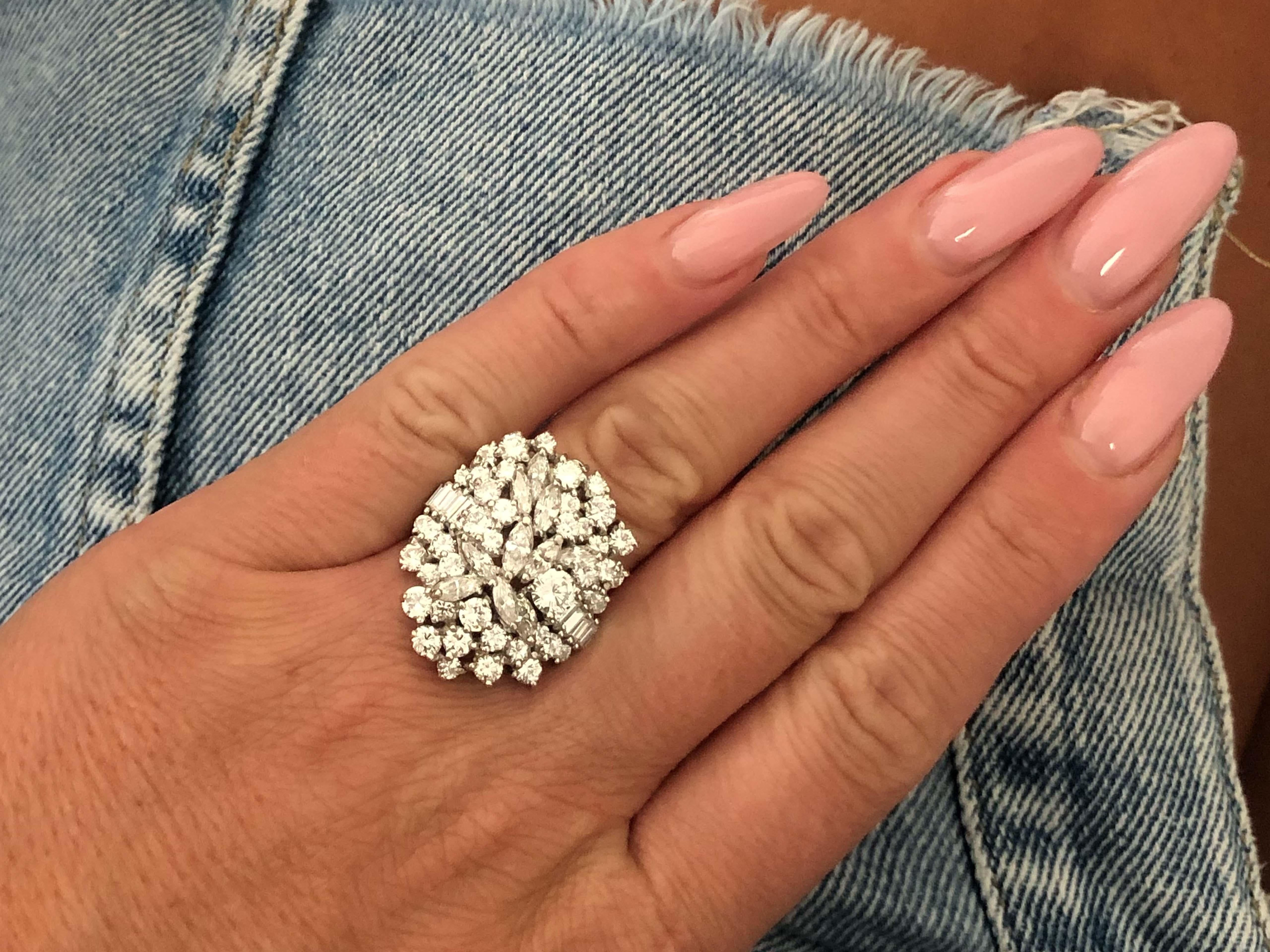 Item Specifications:

Metal: 14k White Gold

Ring Size: 6.25

Total Weight: 14.8  Grams

Diamond Count: 8 baguette cut, 44 brilliant cut, 10 marquise cut

Diamond Carat Weight: ~4.00 carats

Diamond Color: G-H

Diamond Clarity:  VS1-SI1
​
​Ring