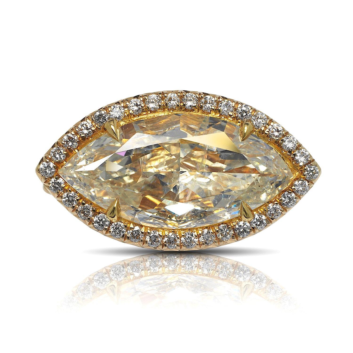 KATE  -4 CT HALO MARQUISE DIAMOND ENGAGEMENT RING BY MIKE NEKTA

GIA CERTIFIED

Center Diamond
Carat Weight: 3 Carats
Color:   Light Yellow
Clarity:  SI1
Cut: MARQUISE BRILLIANT
Measurements:  14.9 x 7.3 x 4.6 mm

 
Ring:
Metal: 18K YELLOW