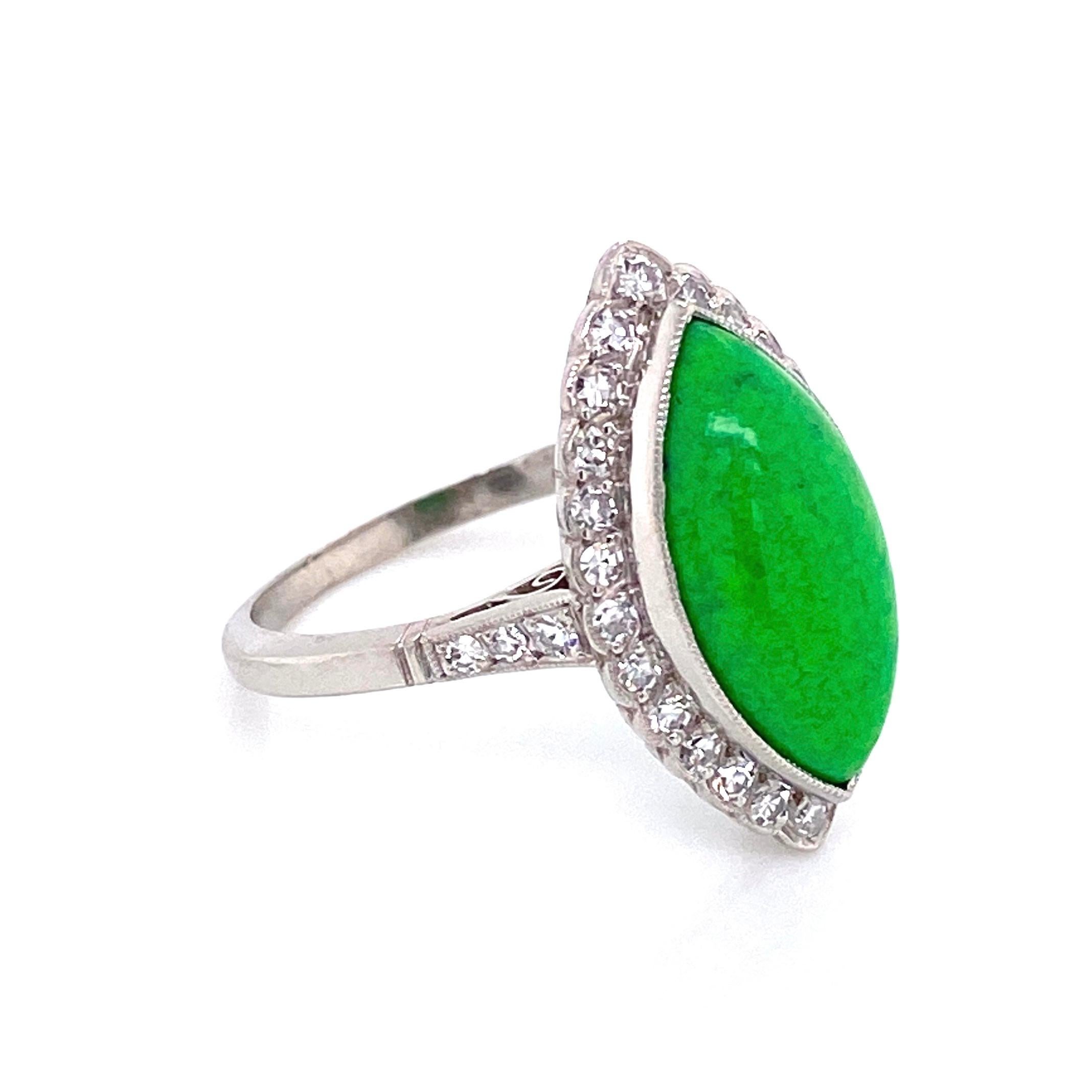 Beautiful, Elegant and finely detailed Art Deco Revival Platinum Cocktail Ring, center securely nestled with a 4 Carat Navette Green Turquoise, surrounded by Diamonds and small Diamonds enhancing the shank. Approx. total weight of Diamonds 0.42